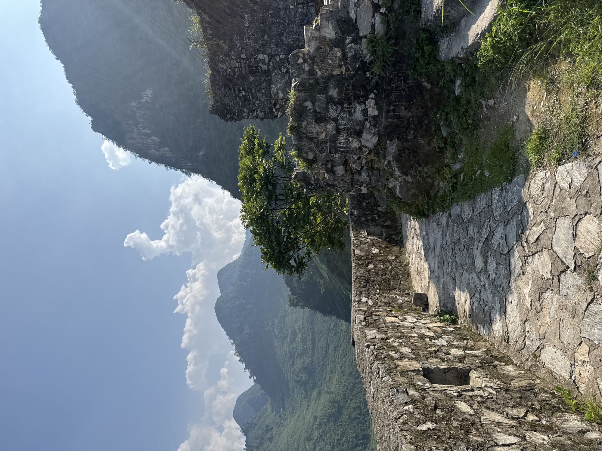 Tourists explore ancient ruins in Vietnamese mountain commune