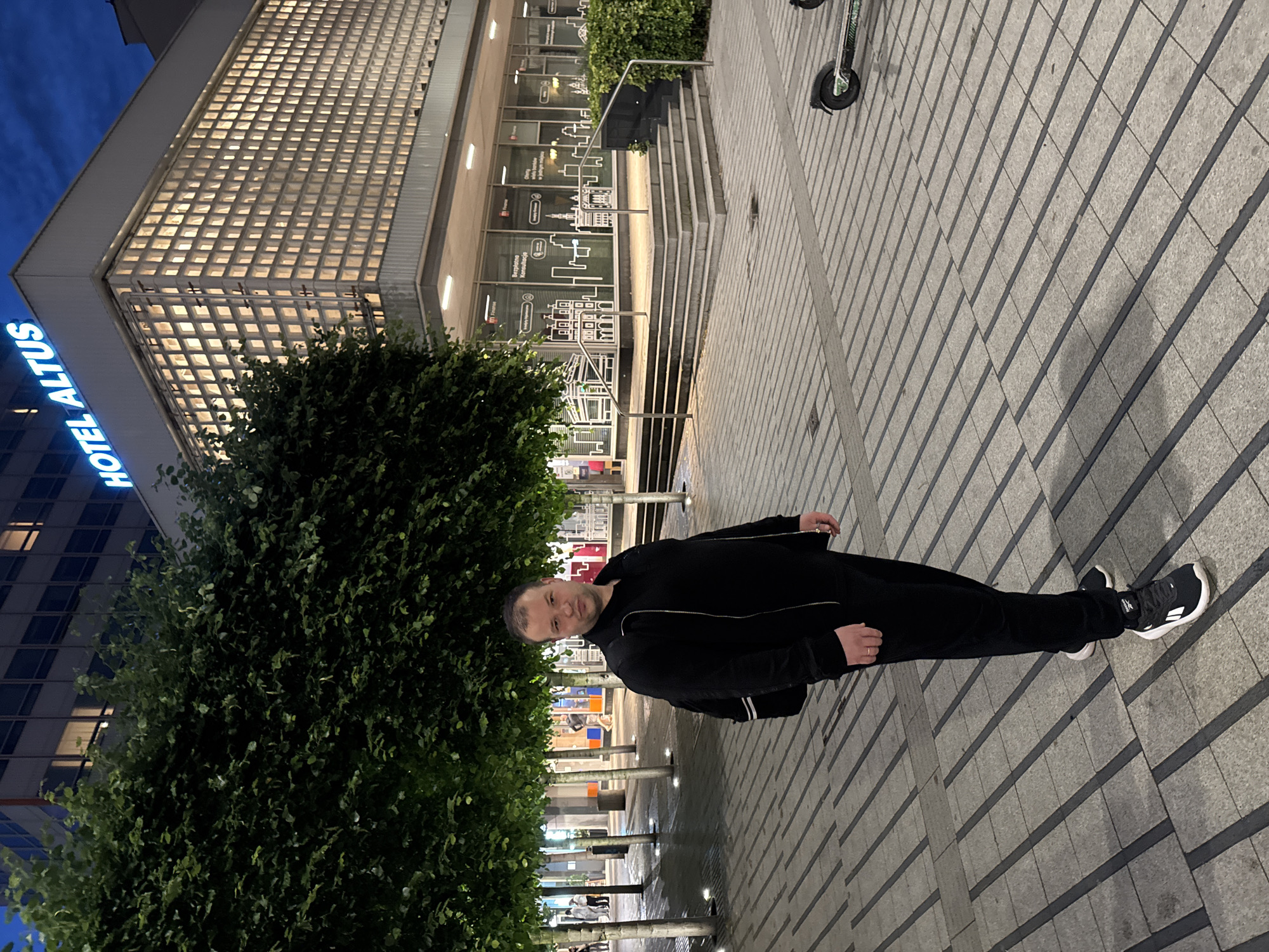 Evening stroll documented across central Poznan commercial district