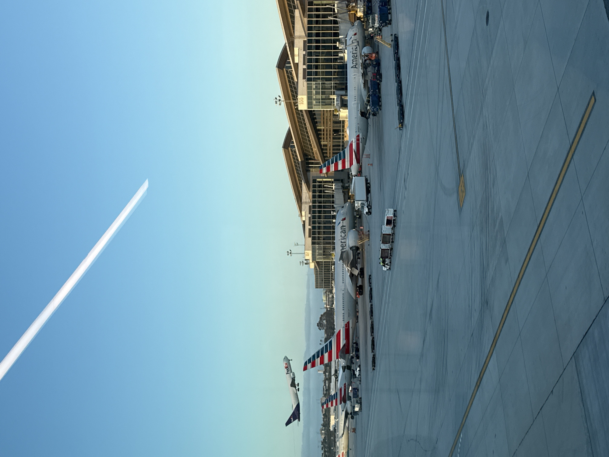 Woman makes peace sign at LAX airport terminal