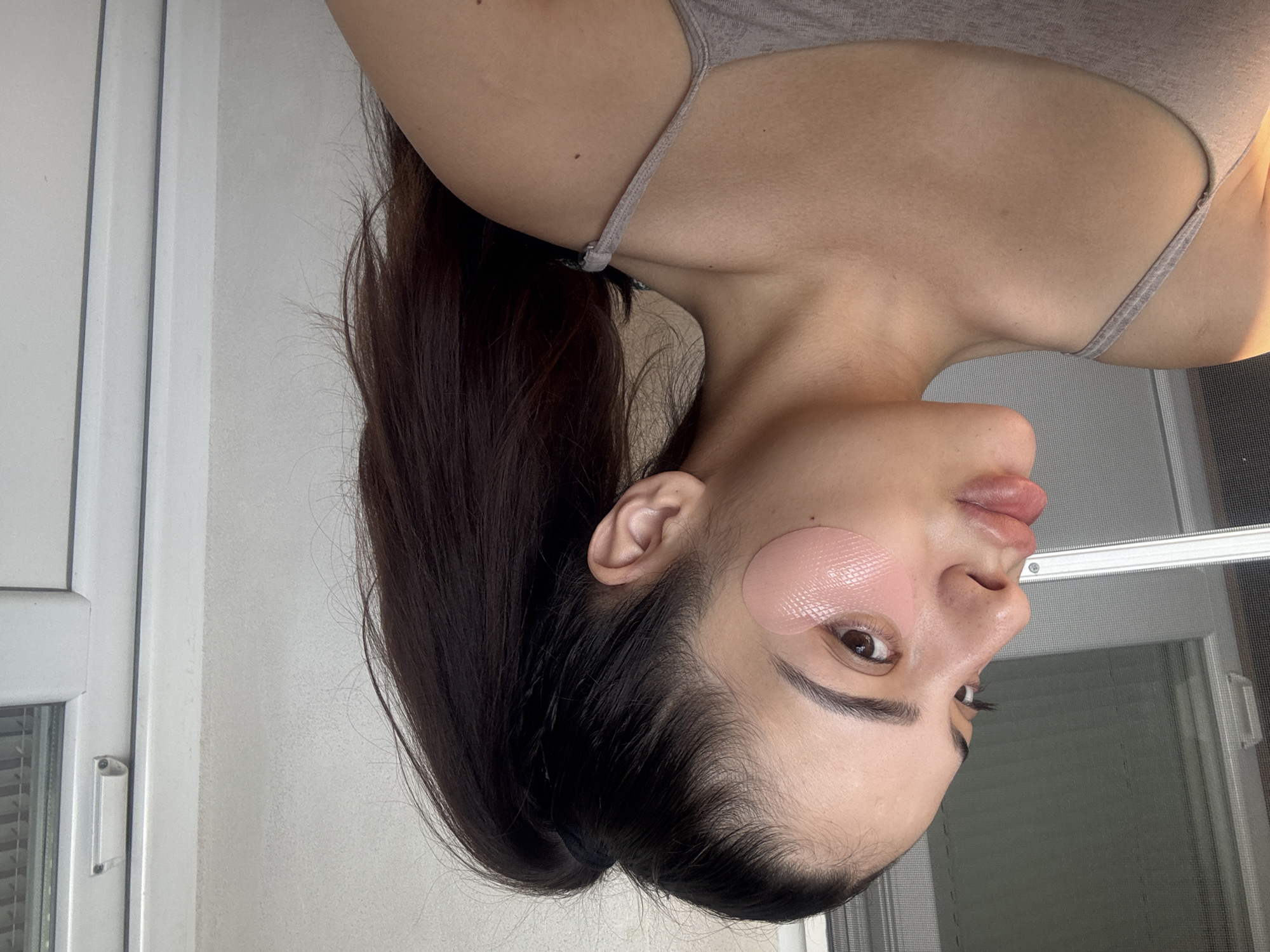 Woman documents morning skincare routine in sunny Plovdiv apartment