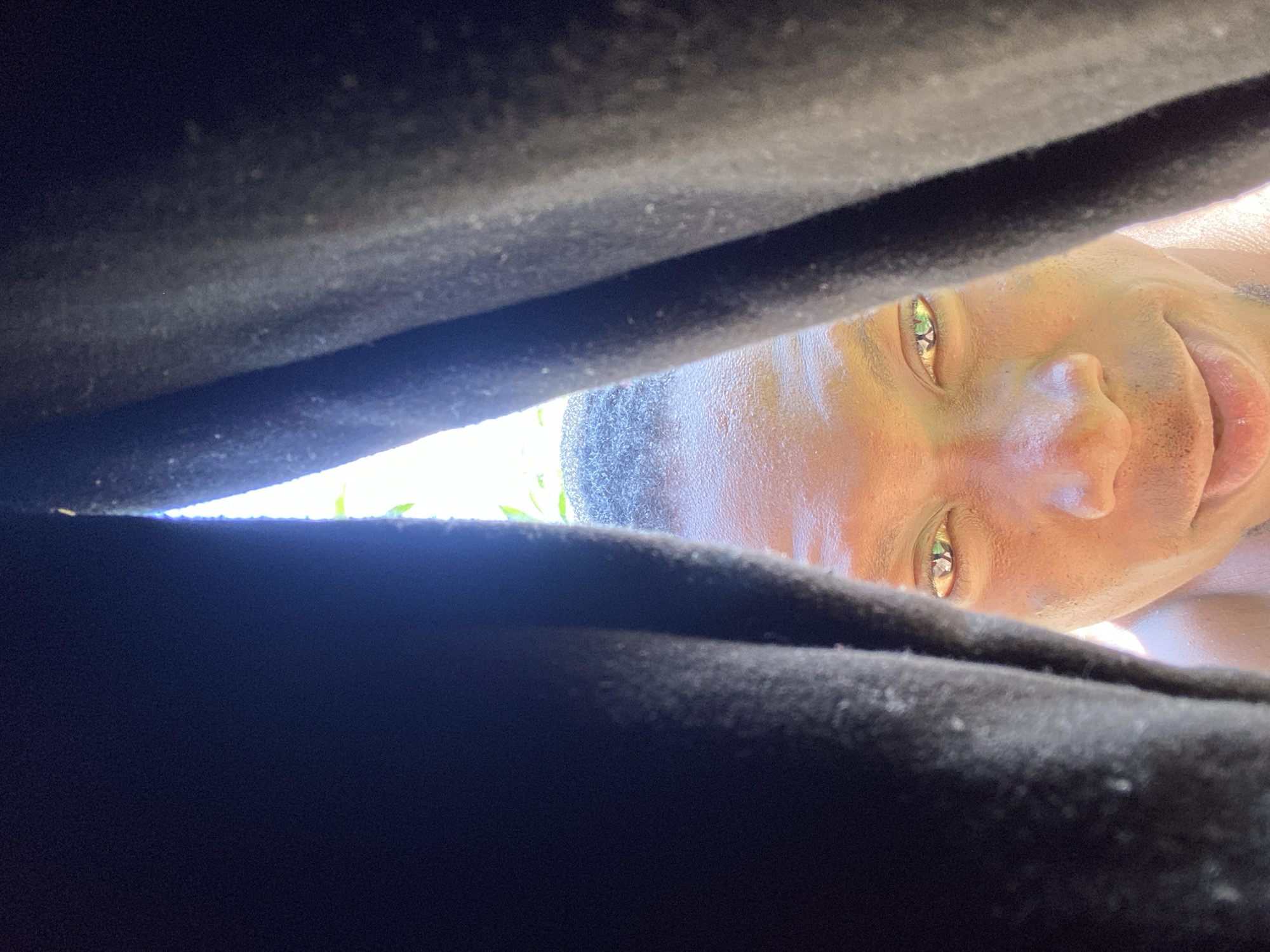 Low-angle selfie sequence under bright Bukuru skies