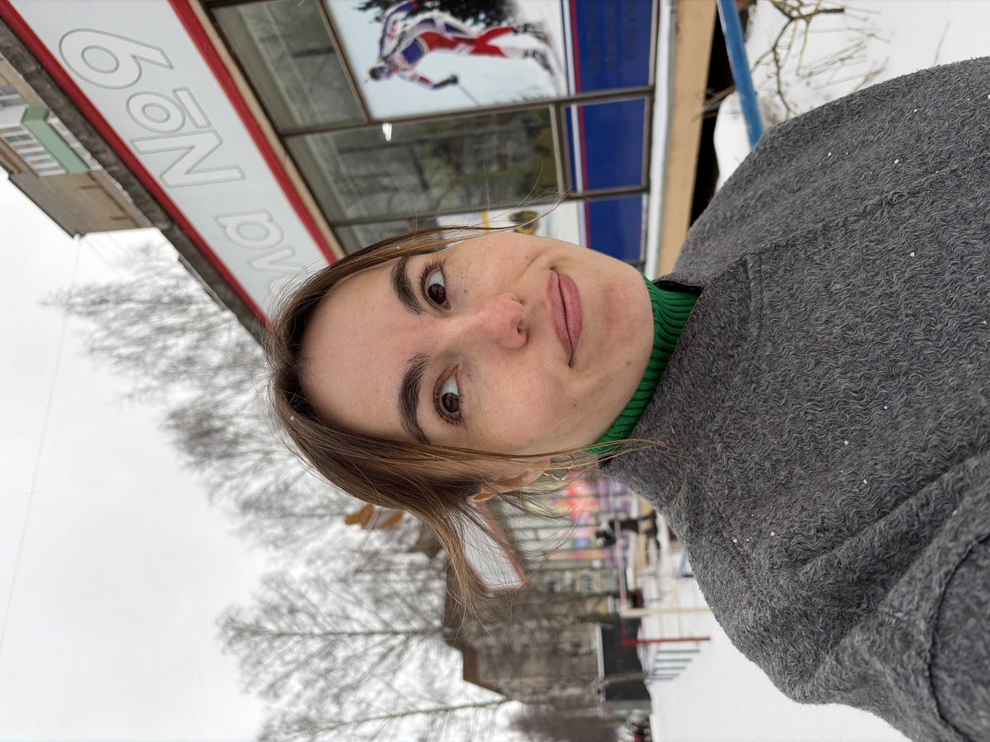 Woman poses for selfie near skating monument in Izhevsk