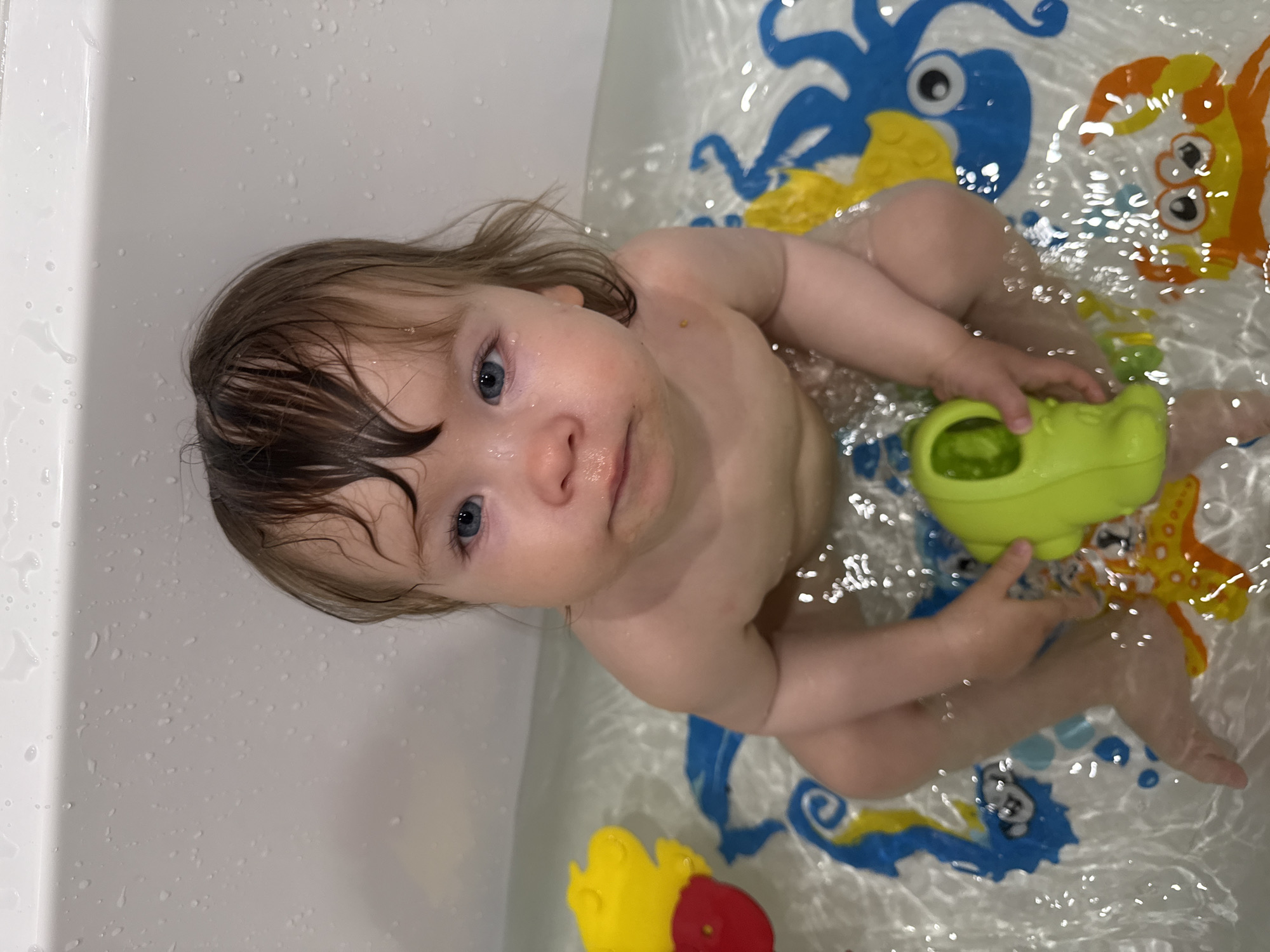 Moscow mother documents toddler's bath time in tiled bathroom