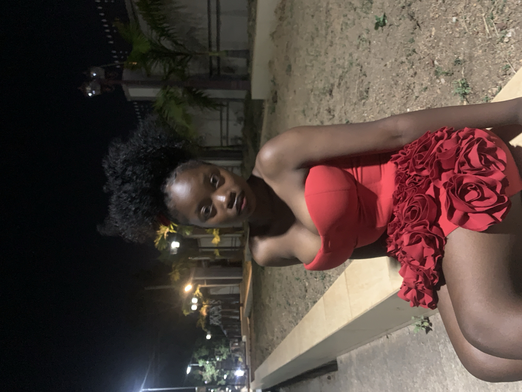 Evening fashion photoshoot captures women in colorful dresses in Jos