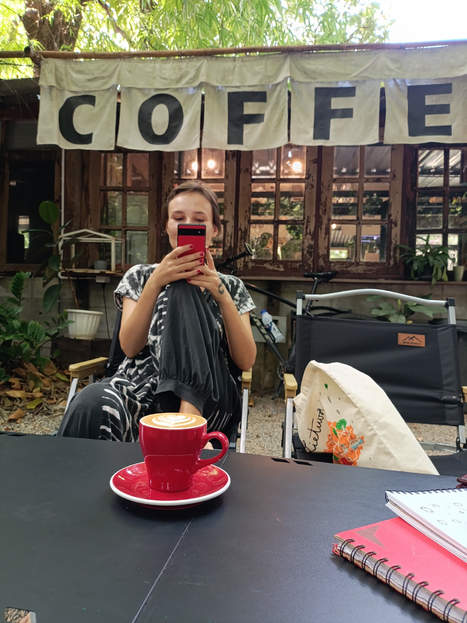 Motorcycle ride pause at a rustic café in Ban Fon