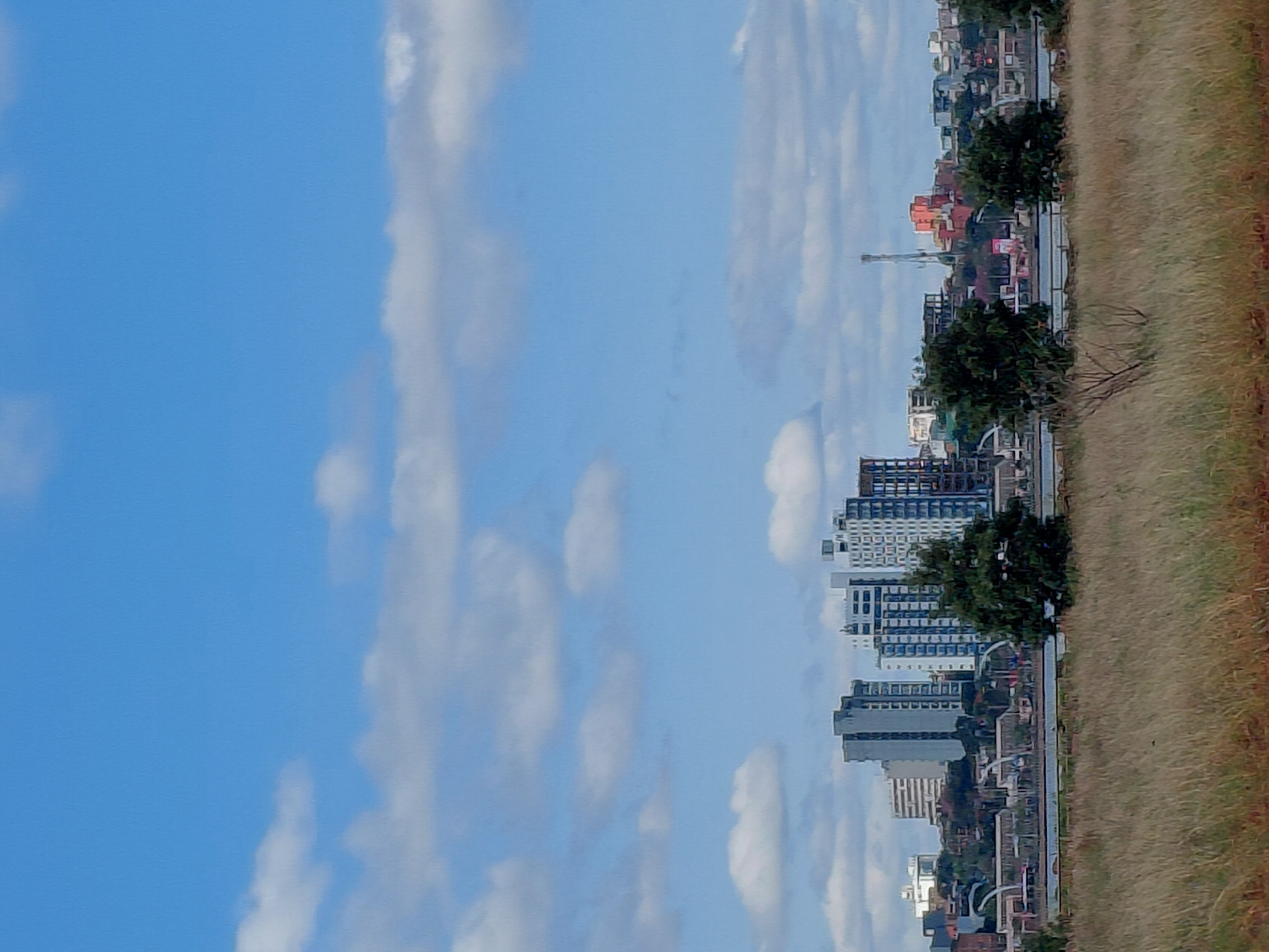 Encarnación skyline and Paraná River waterfront on a clear afternoon