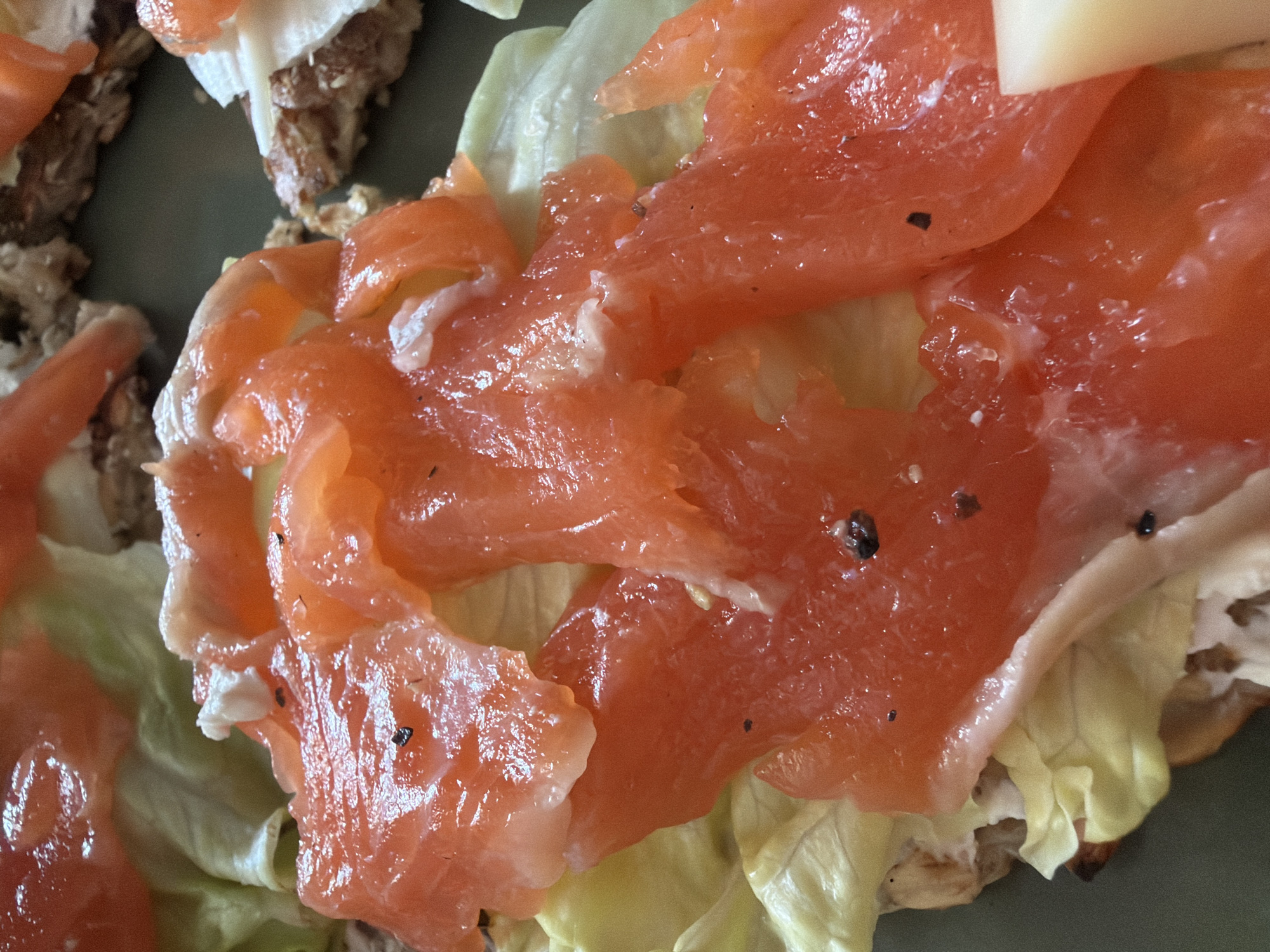 Woman prepares salmon breakfast in Saint Petersburg morning