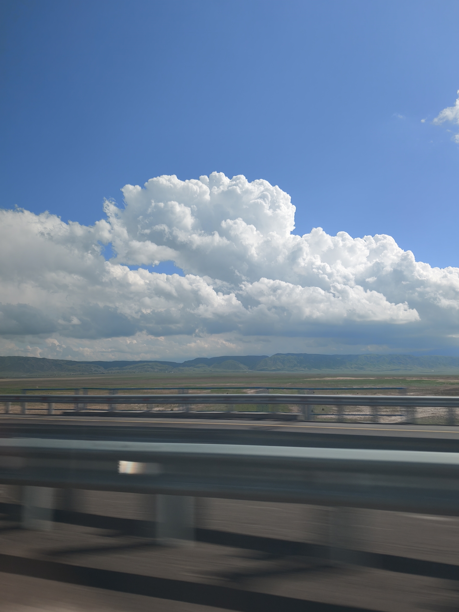 Highway travel captured across Kazakhstan's vast landscape