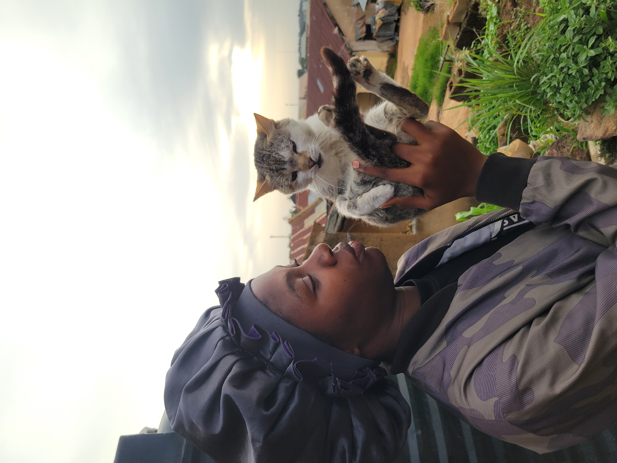 Everyday life documented in Jos residential neighborhood over afternoon