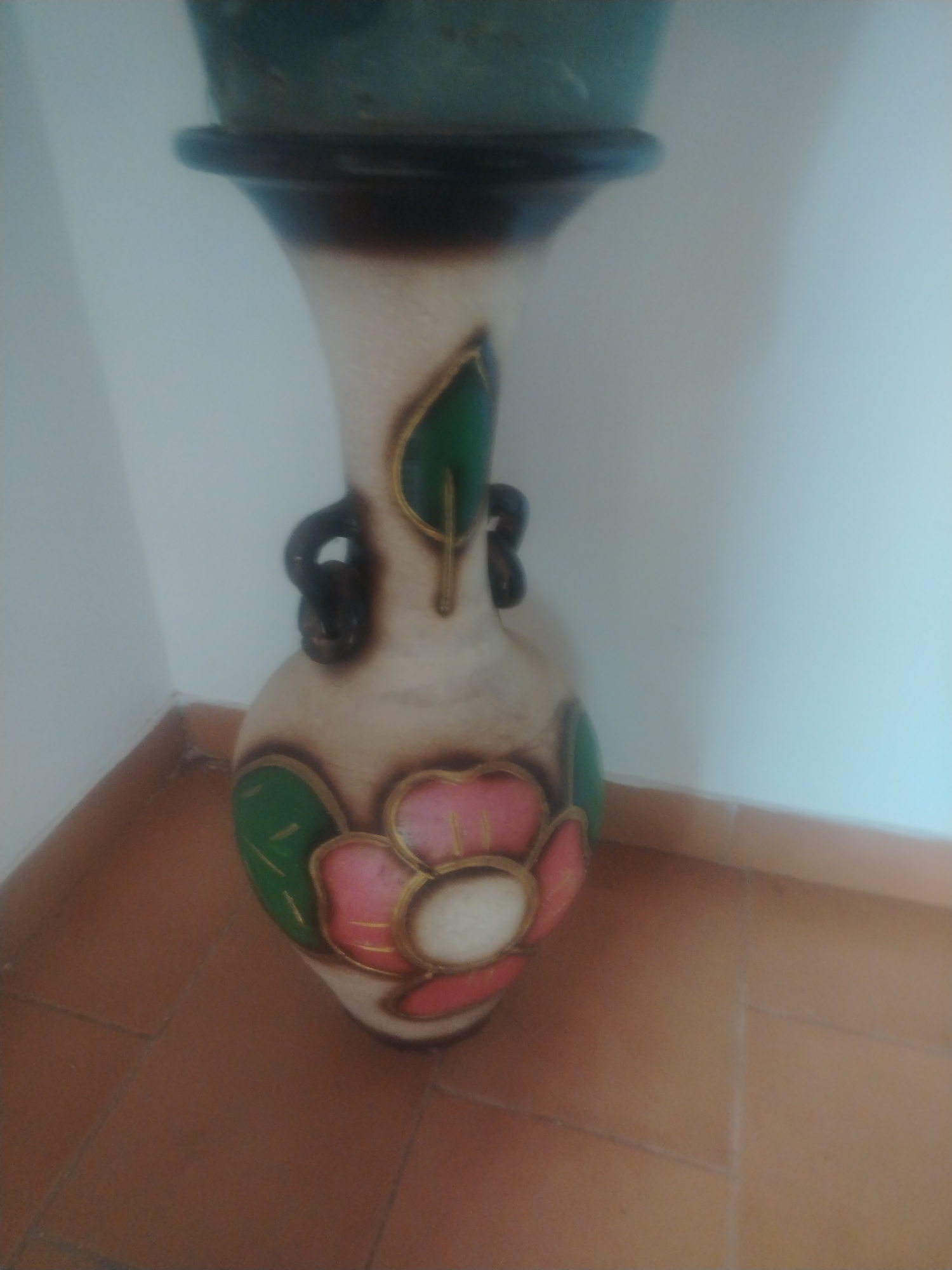 Folk art and plant collection in Venezuelan home