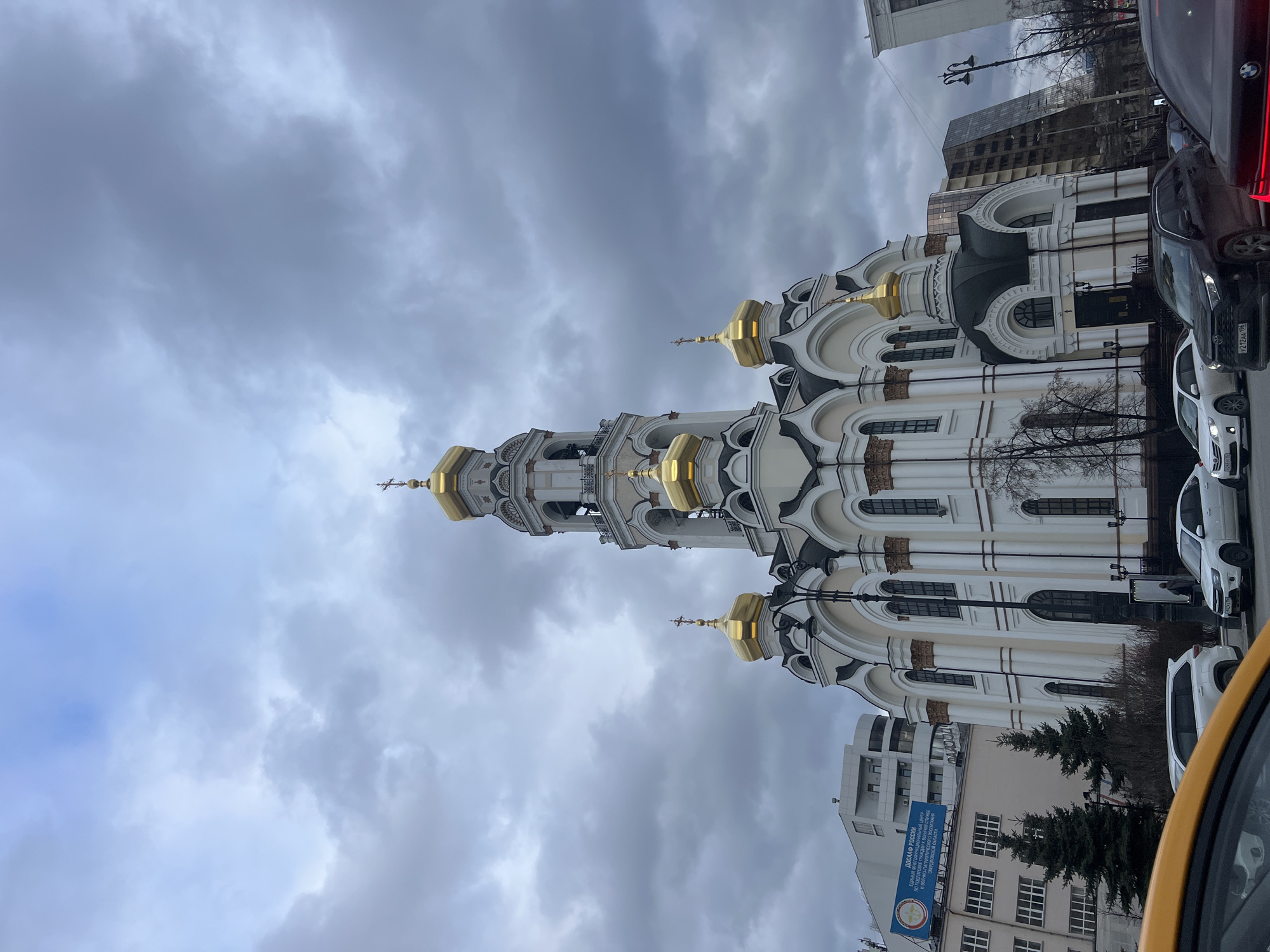 Visitors document Church on Blood in Yekaterinburg under cloudy skies