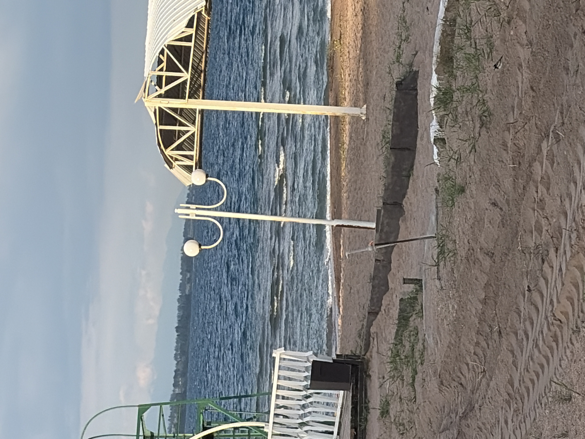 Overcast afternoon at a pier, roses and coastal views