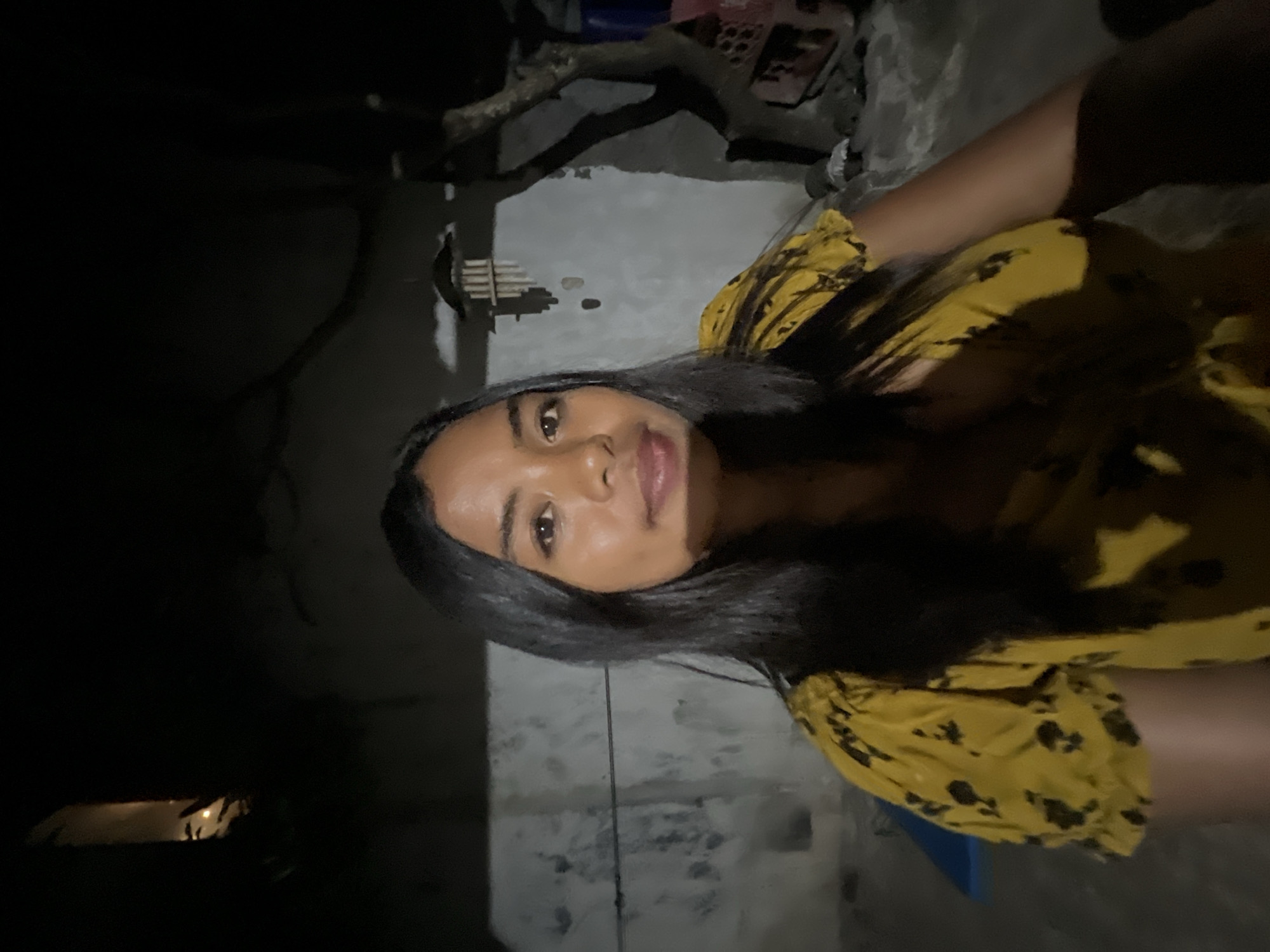 Nighttime hangout in Denpasar, crescent moon overhead