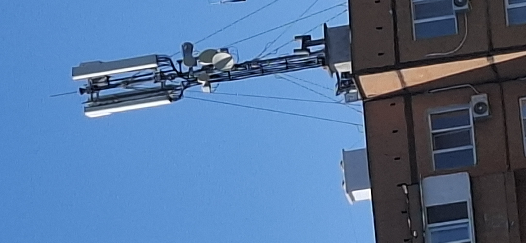 Rooftop antennas, a blue bottle, and a bulletin board in Vidin