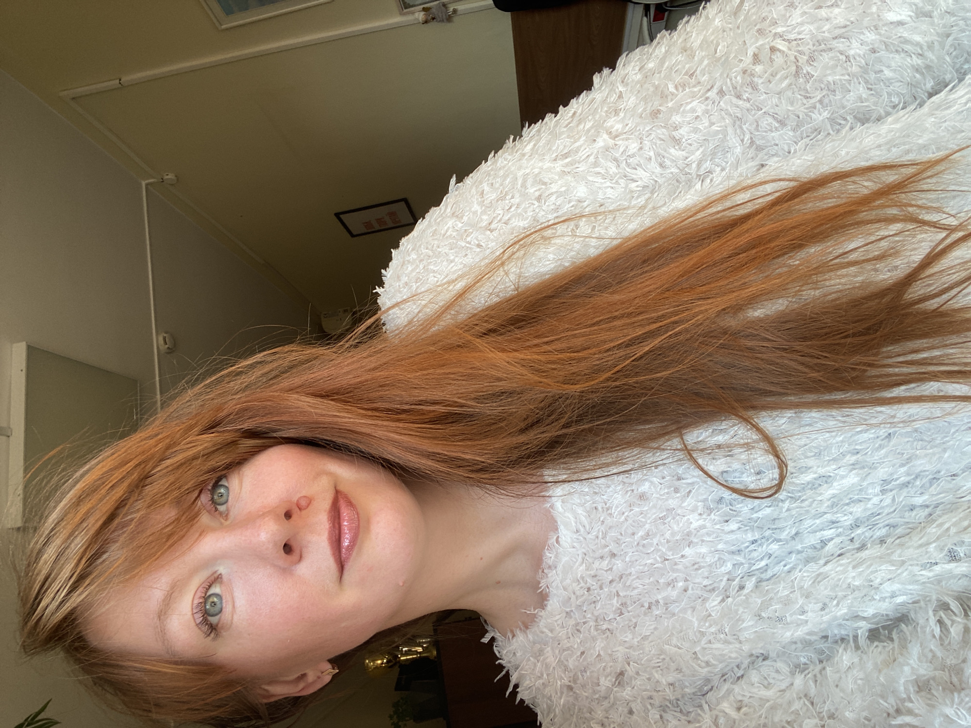Woman takes morning selfies in Krasnoyarsk apartment