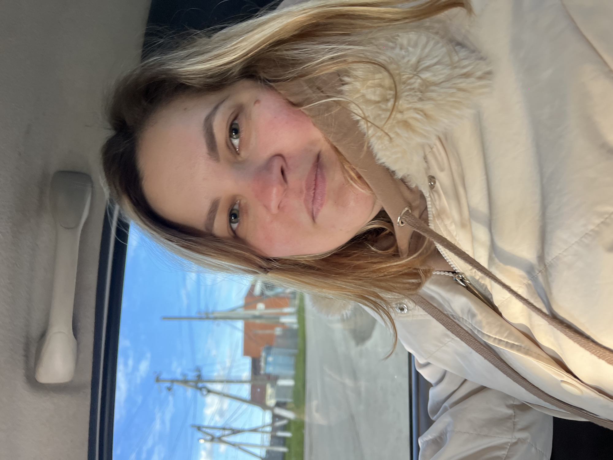 Woman takes selfies during car journey in rural Russia