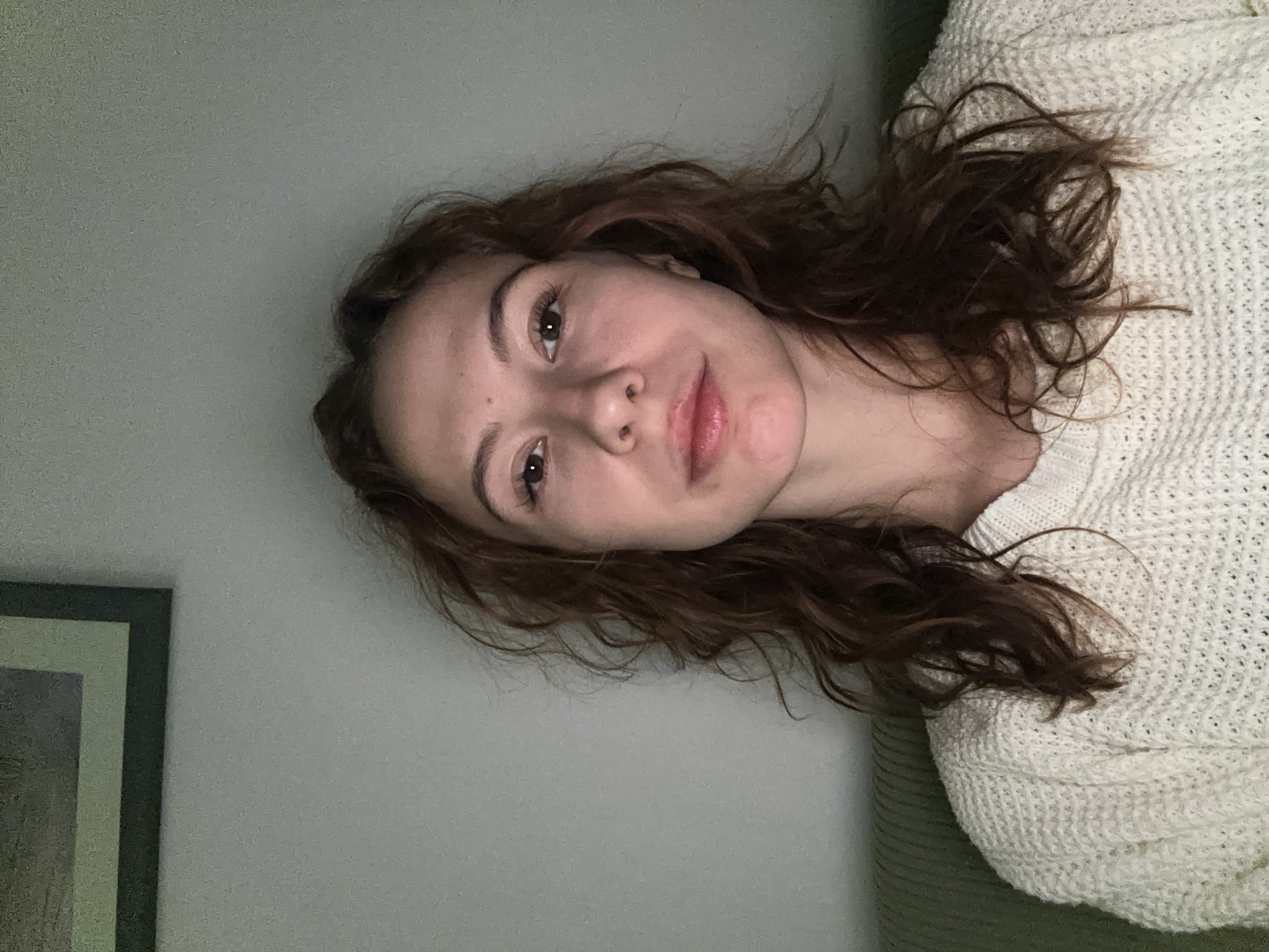 Woman takes multiple selfies indoors in Novi Sad
