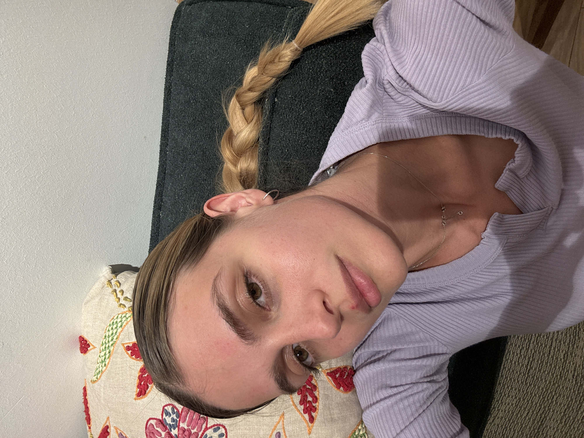 Person poses for camera in indoor photoshoot session