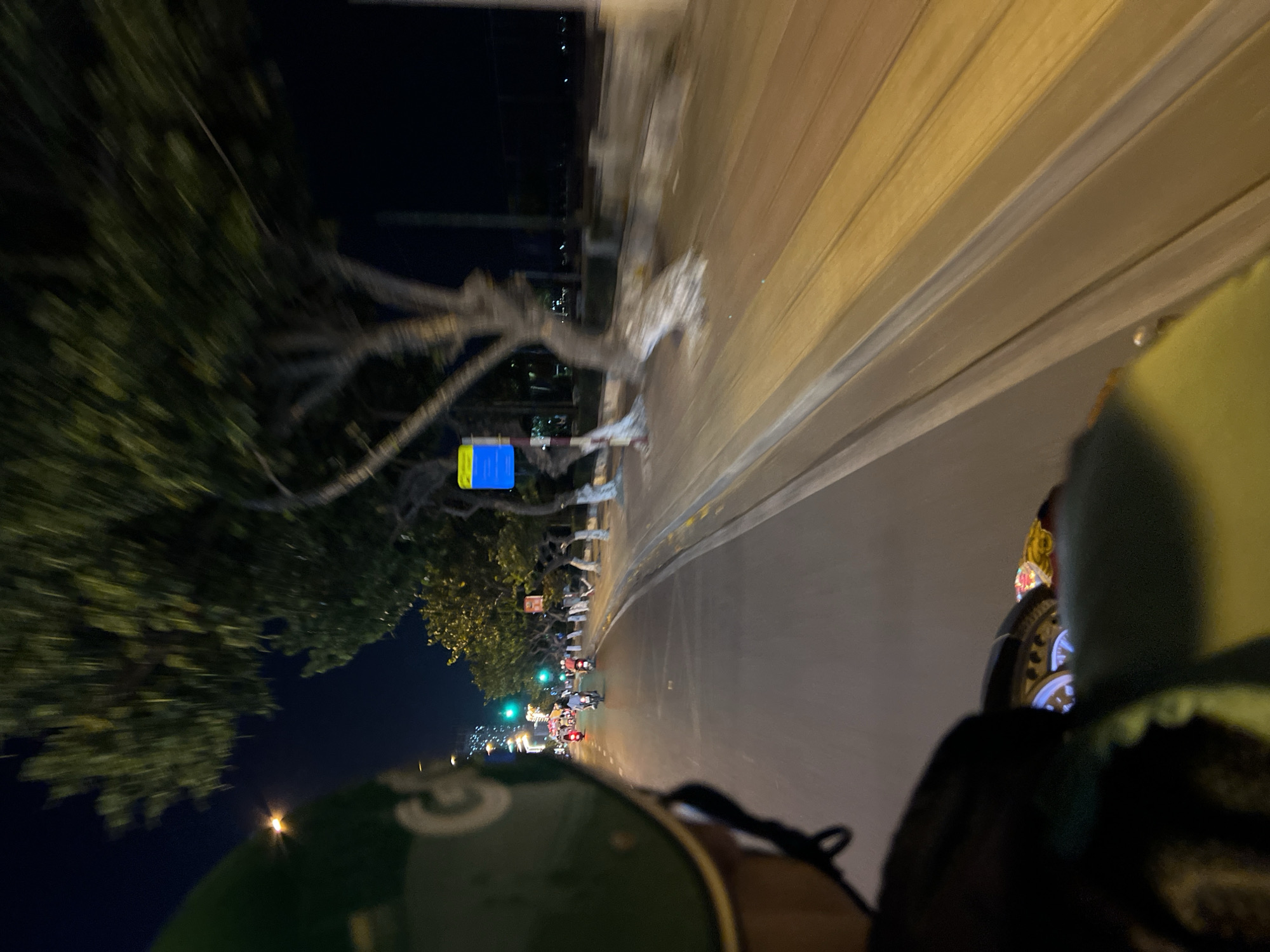 Nighttime traffic flows through illuminated Nha Trang streets