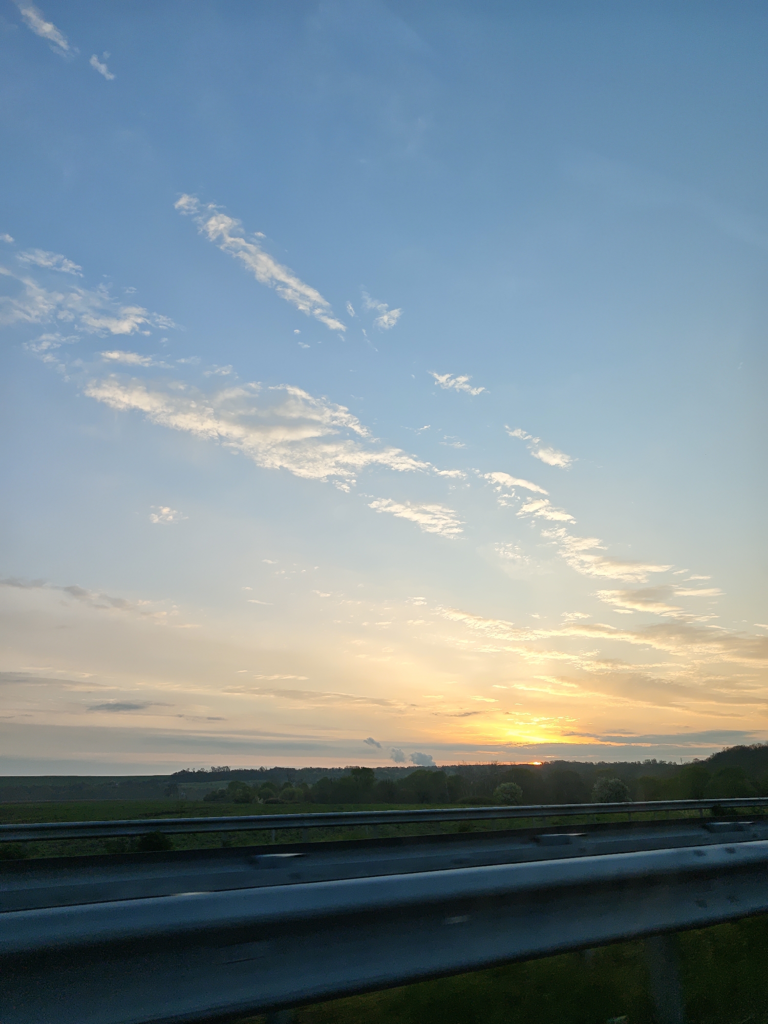 Highway sunset documented near Dobrich, Bulgaria