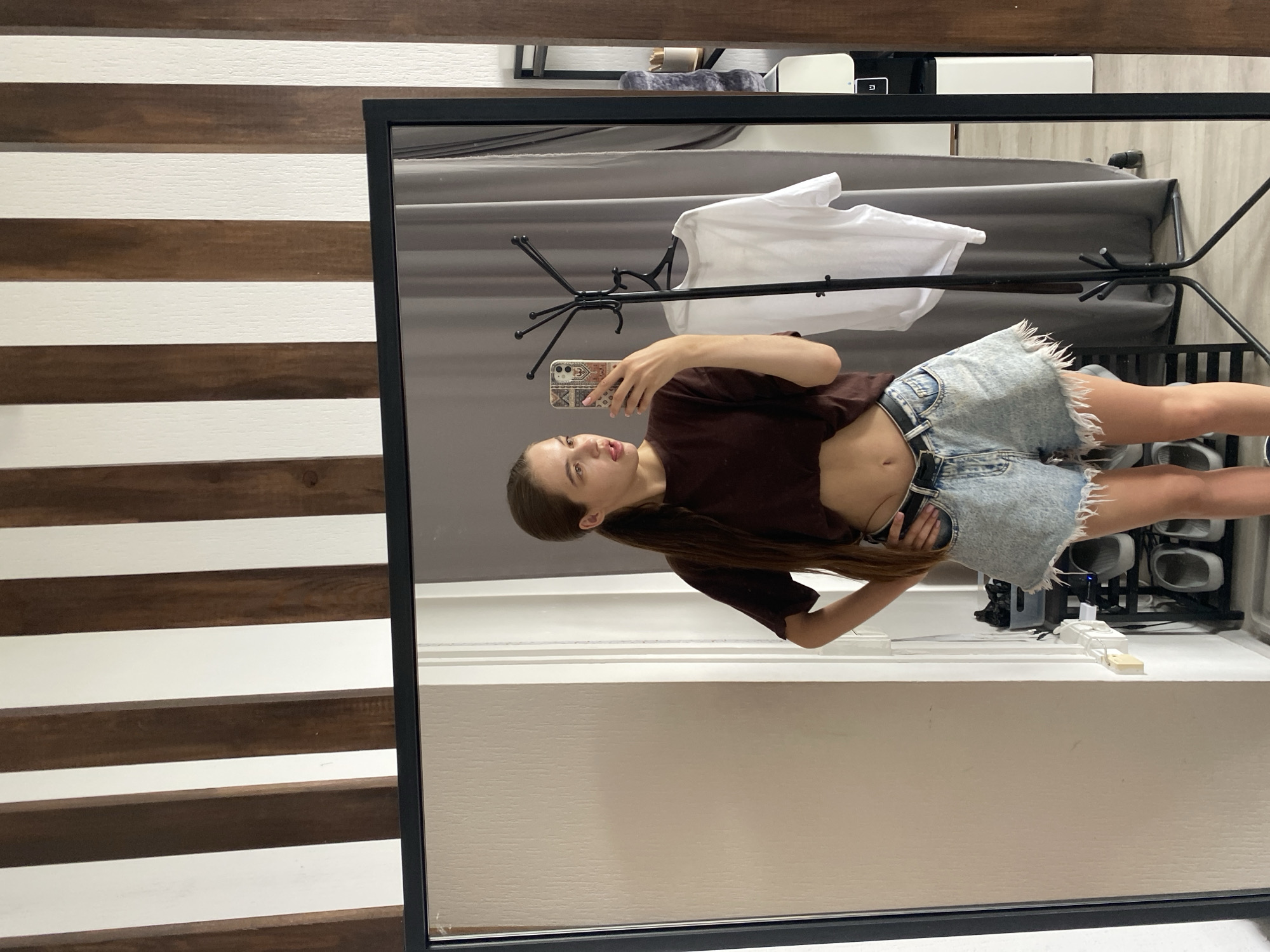 Quick selfie session in brown tee and denim shorts