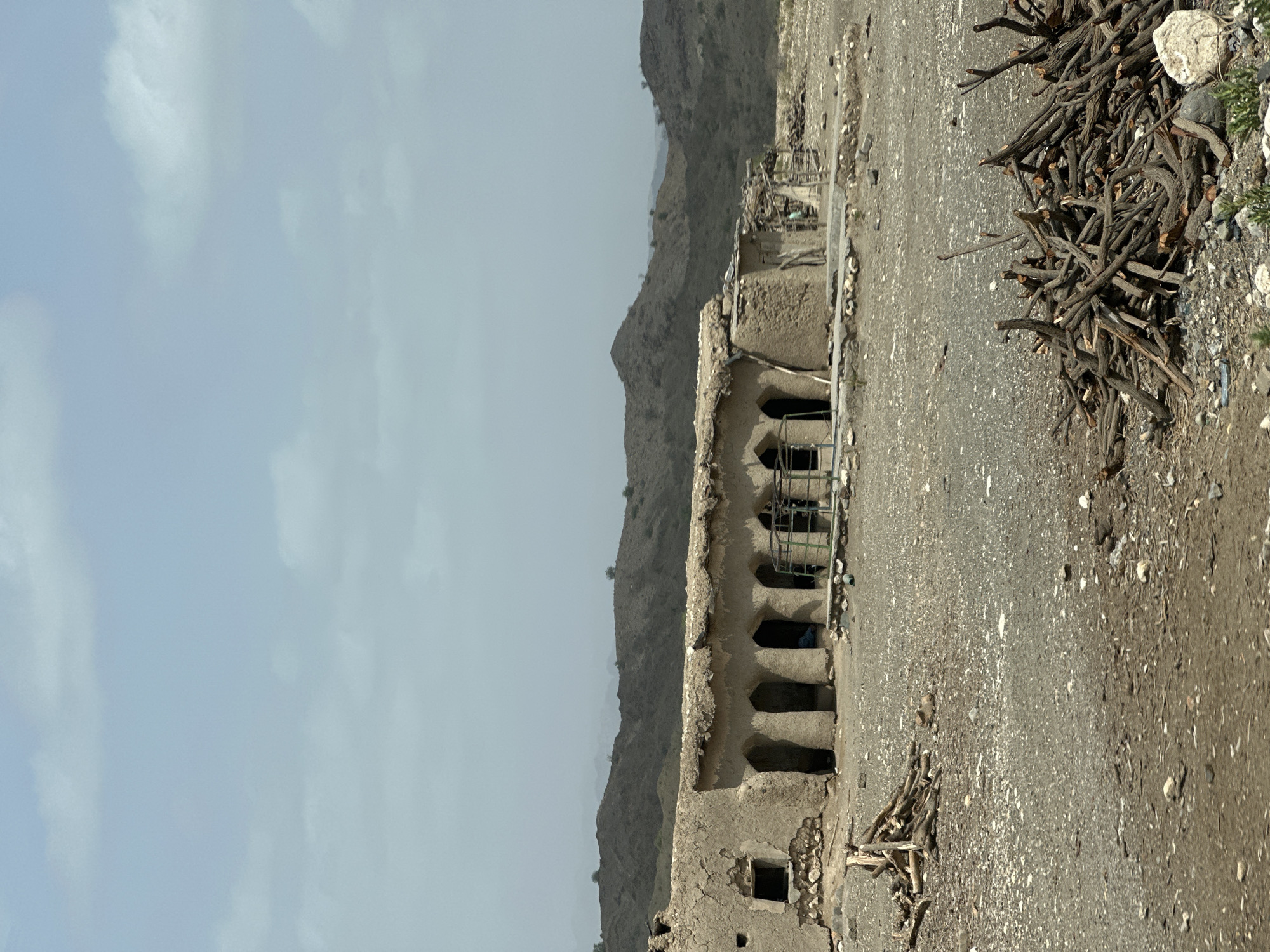 Crumbling mud-brick ruin in arid hills near Nimmi, Pakistan