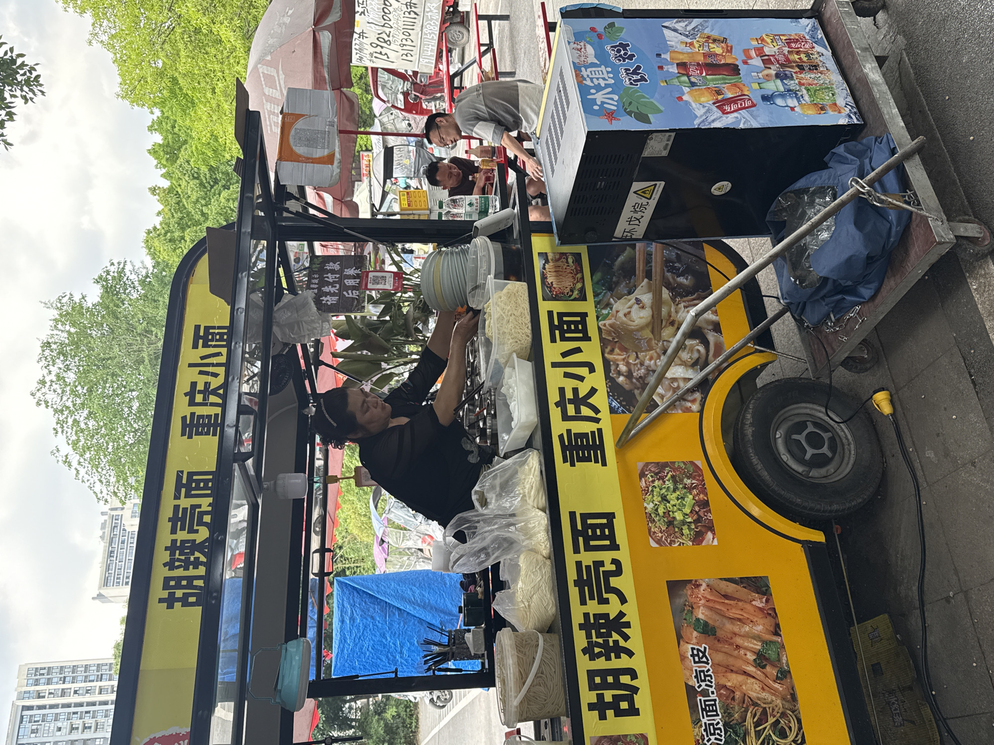 Early morning street vendors, workers active in Chongqing district