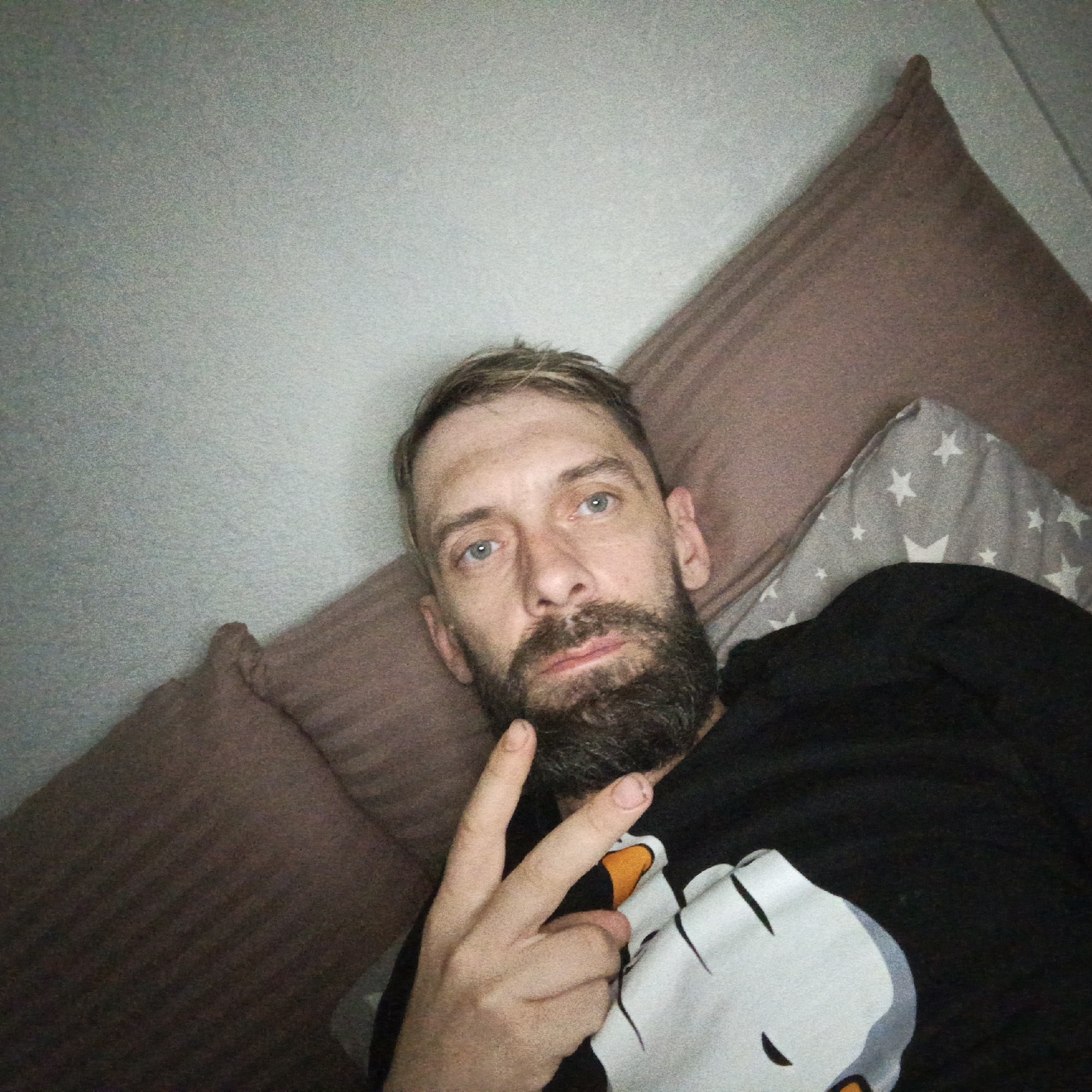 Man takes selfie indoors in Markovskiy, Russia