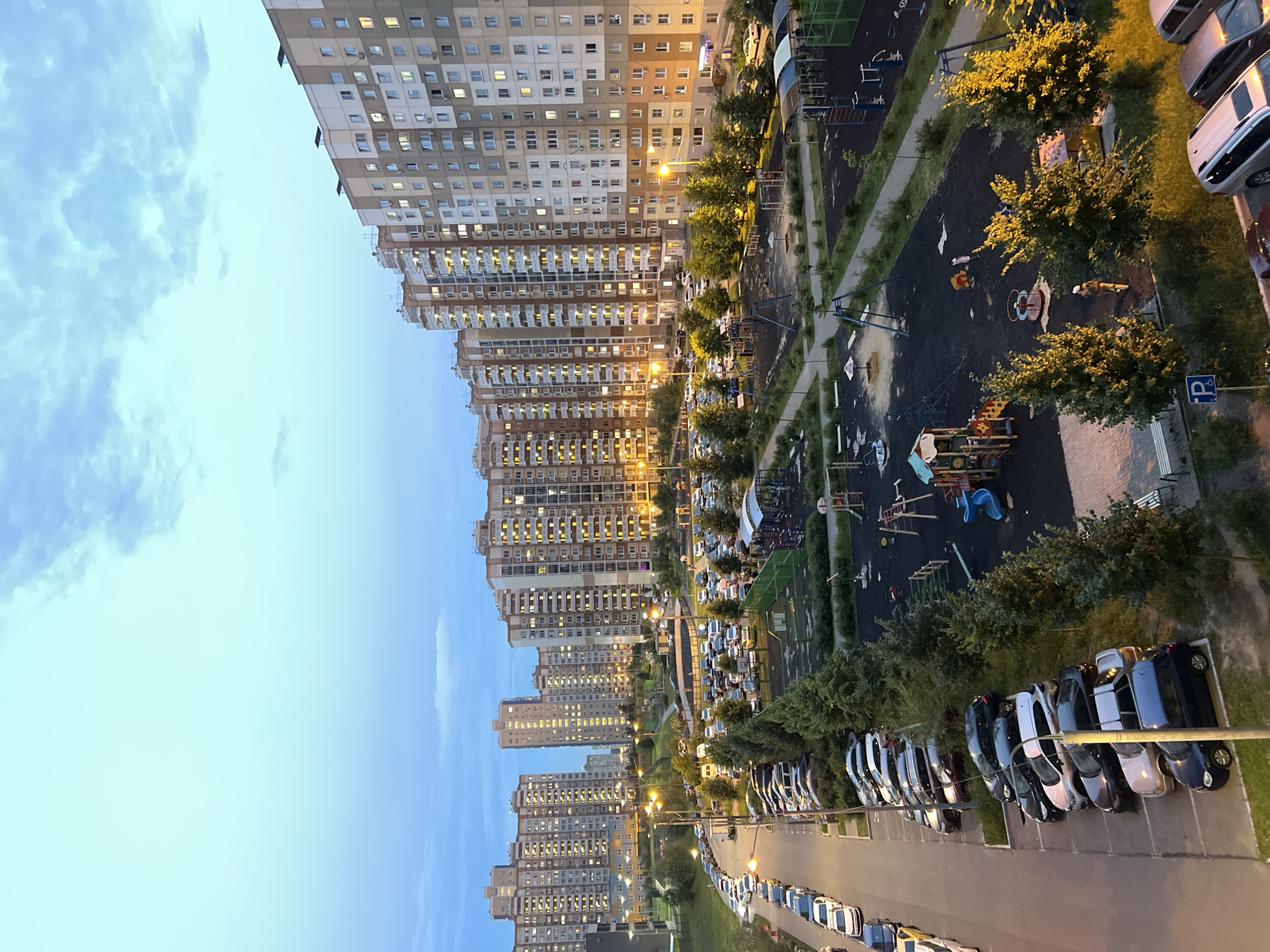 Apartment buildings at dusk, shot from multiple angles at golden hour