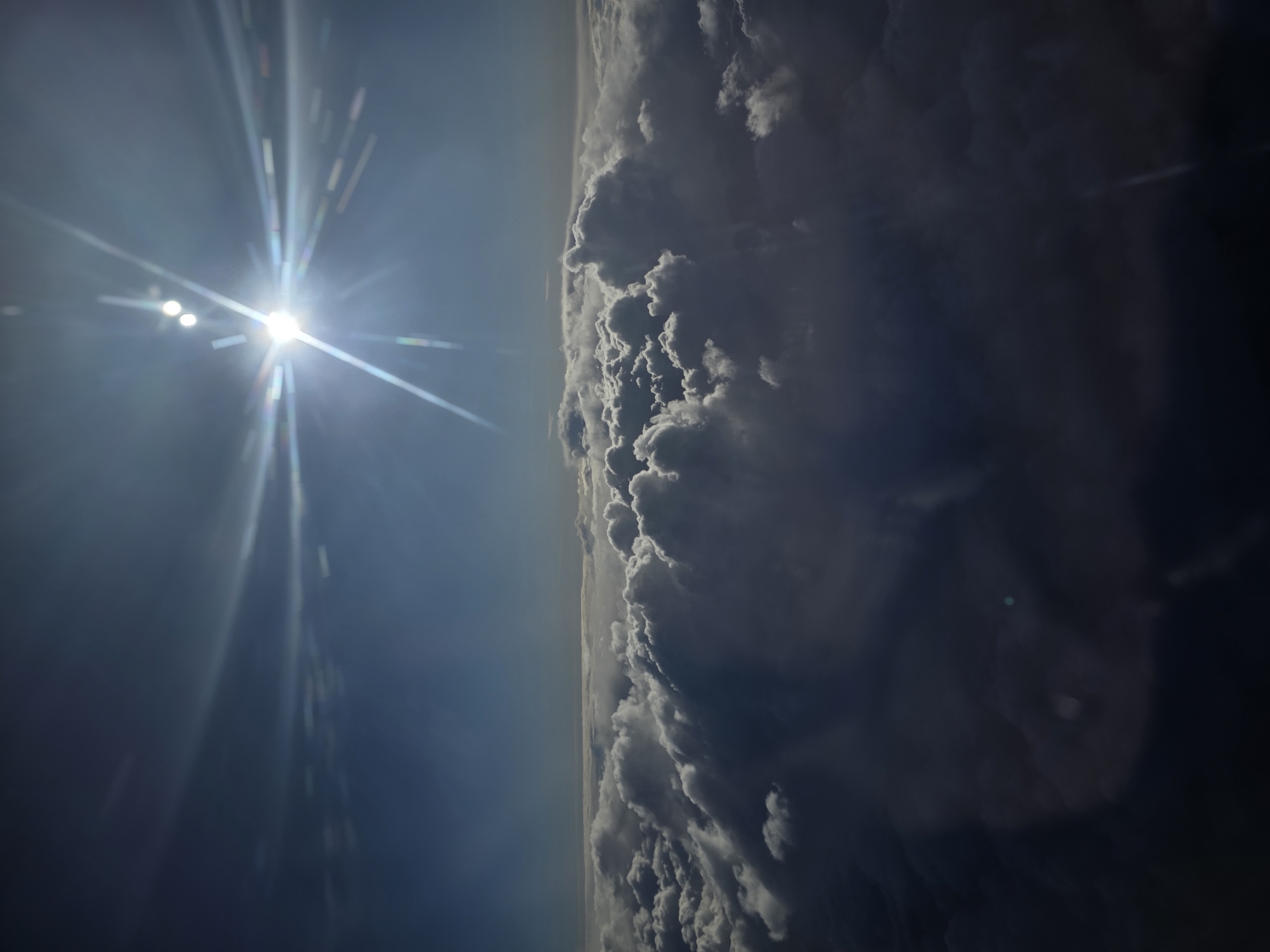 Aerial view captured over Kommunarka showing sunlight and clouds