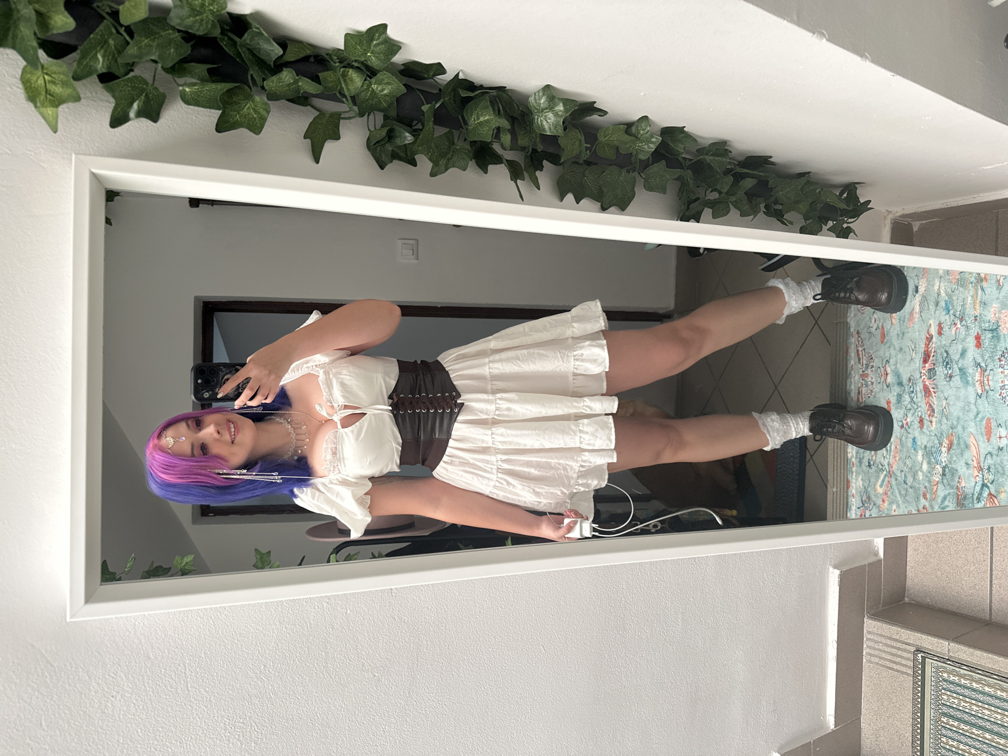 Woman takes mirror selfie in colorful outfit in Zagreb