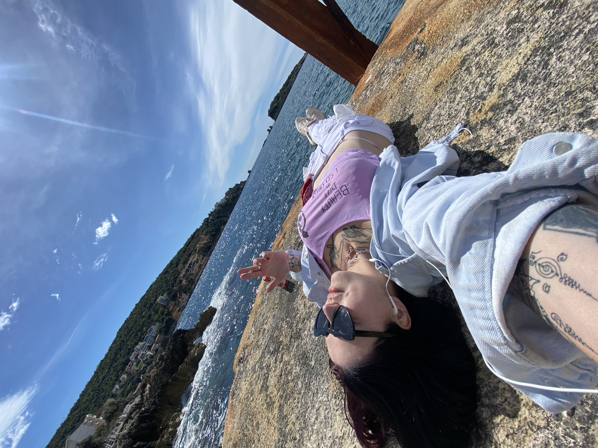 Person photographed at multiple coastal spots in Montenegro