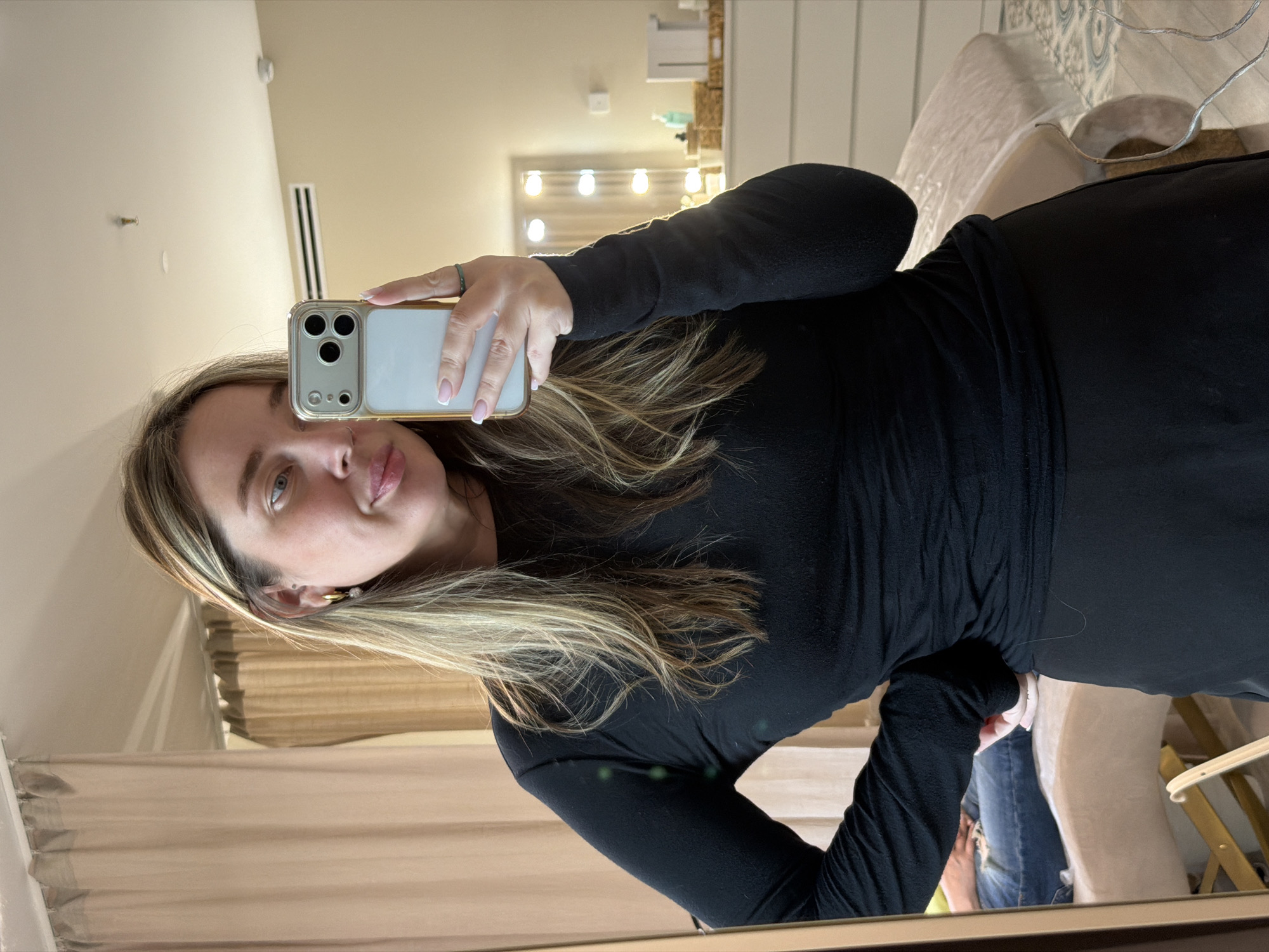 Woman takes mirror selfies in Dolgoprudny apartment