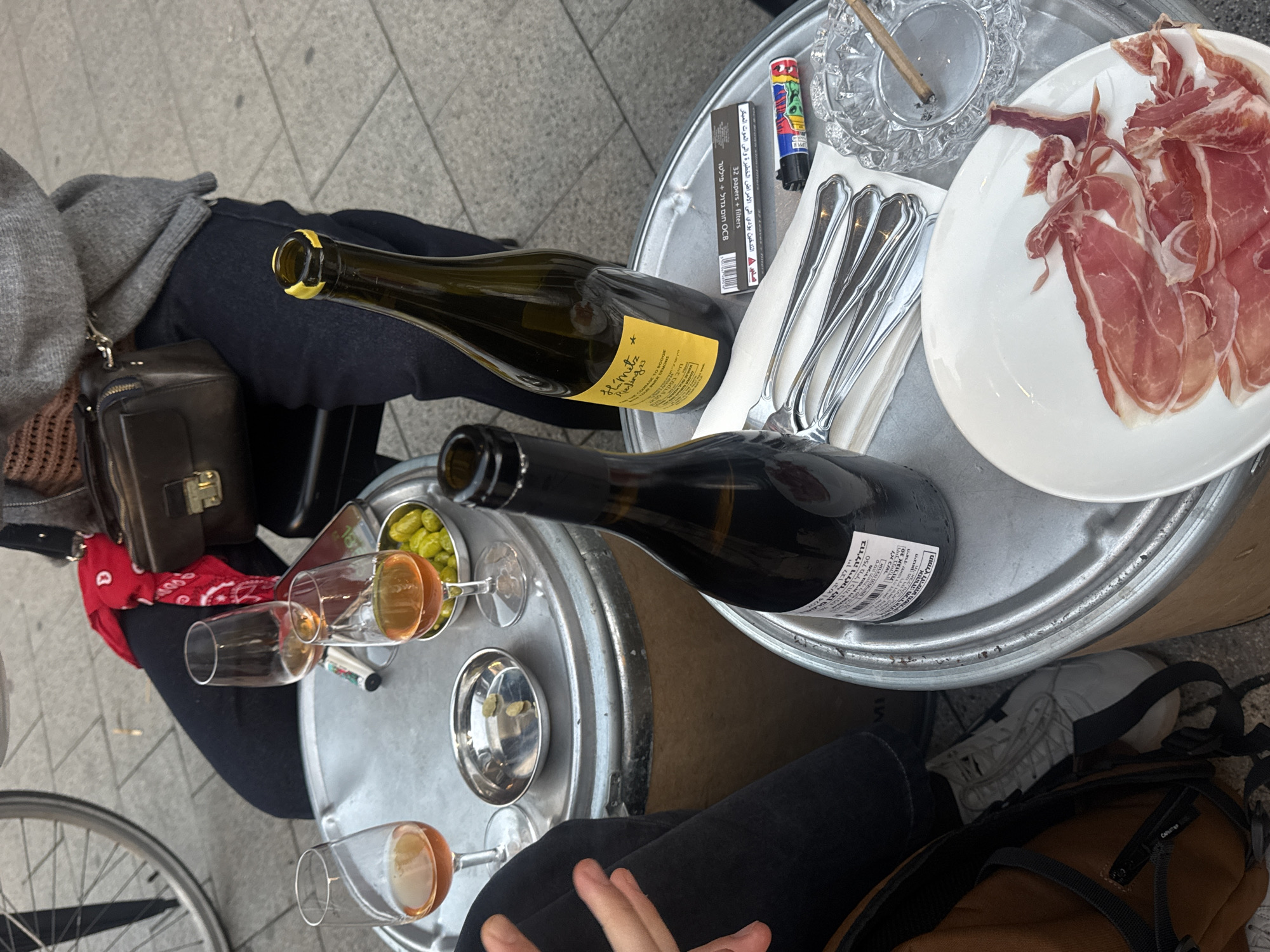 Wine and ham dining scene captured in Al Jizah