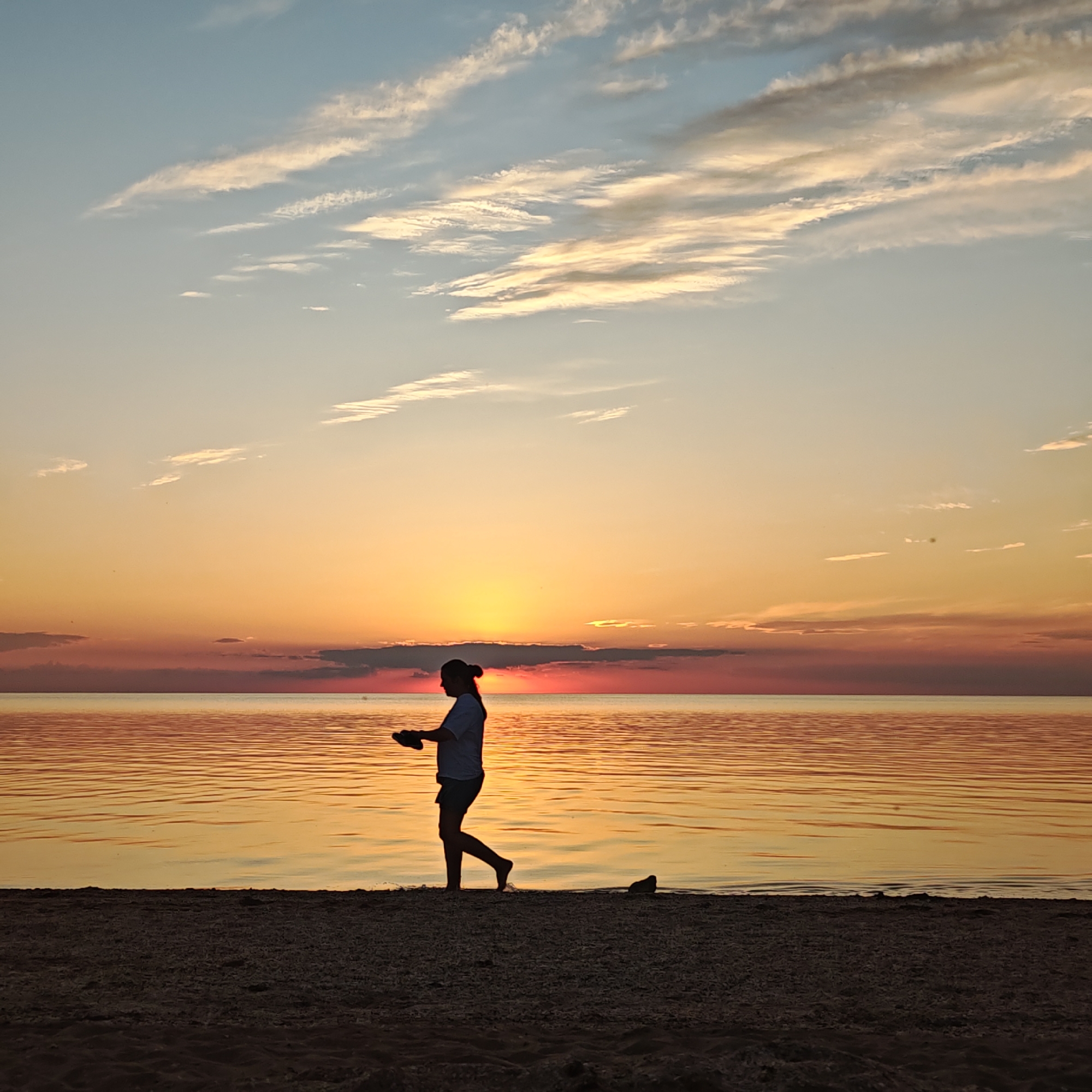 Sunset observed by beachgoers in Shcholkino, Ukraine