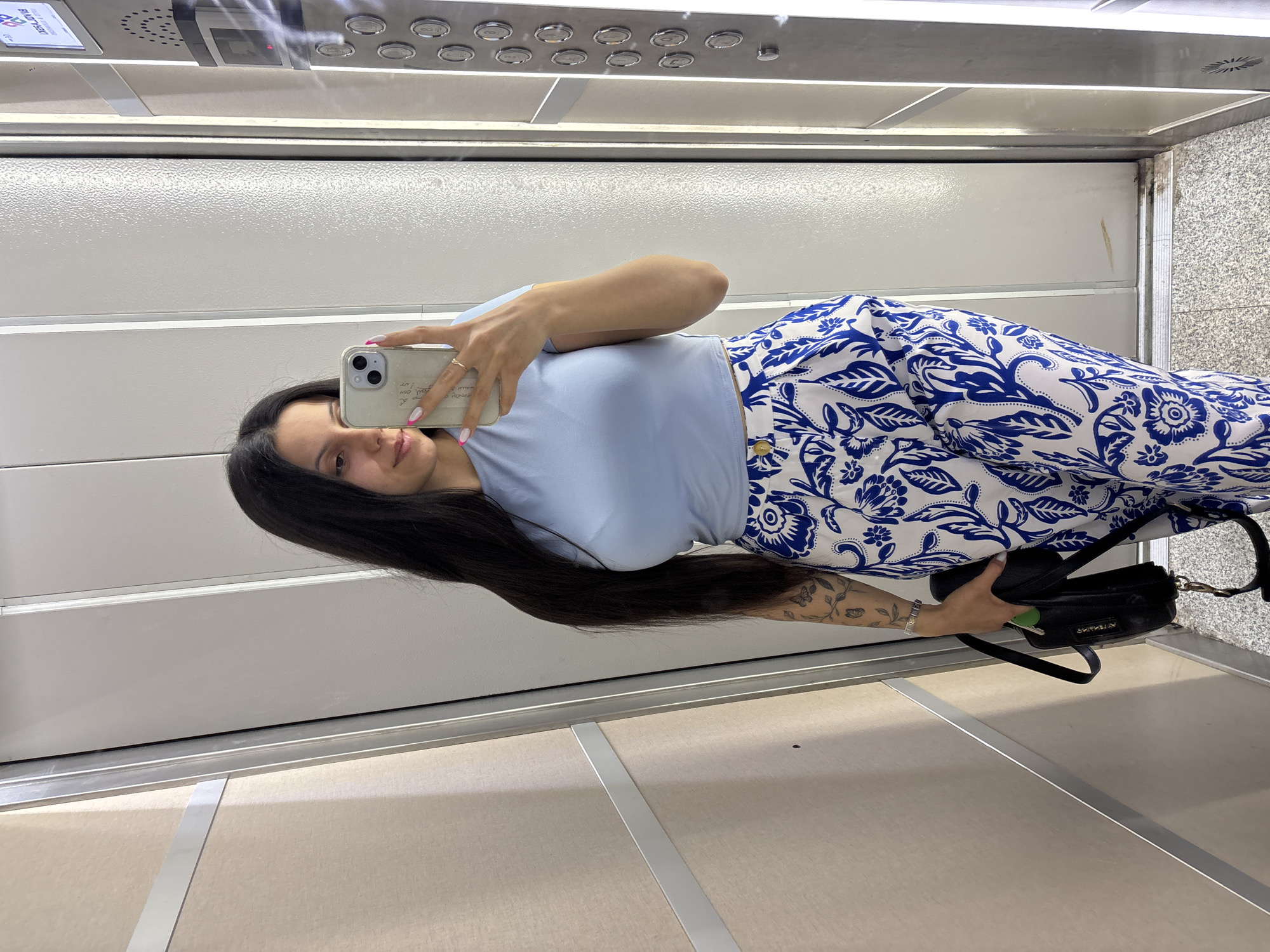 Woman takes selfie in elevator in Sliven, Bulgaria
