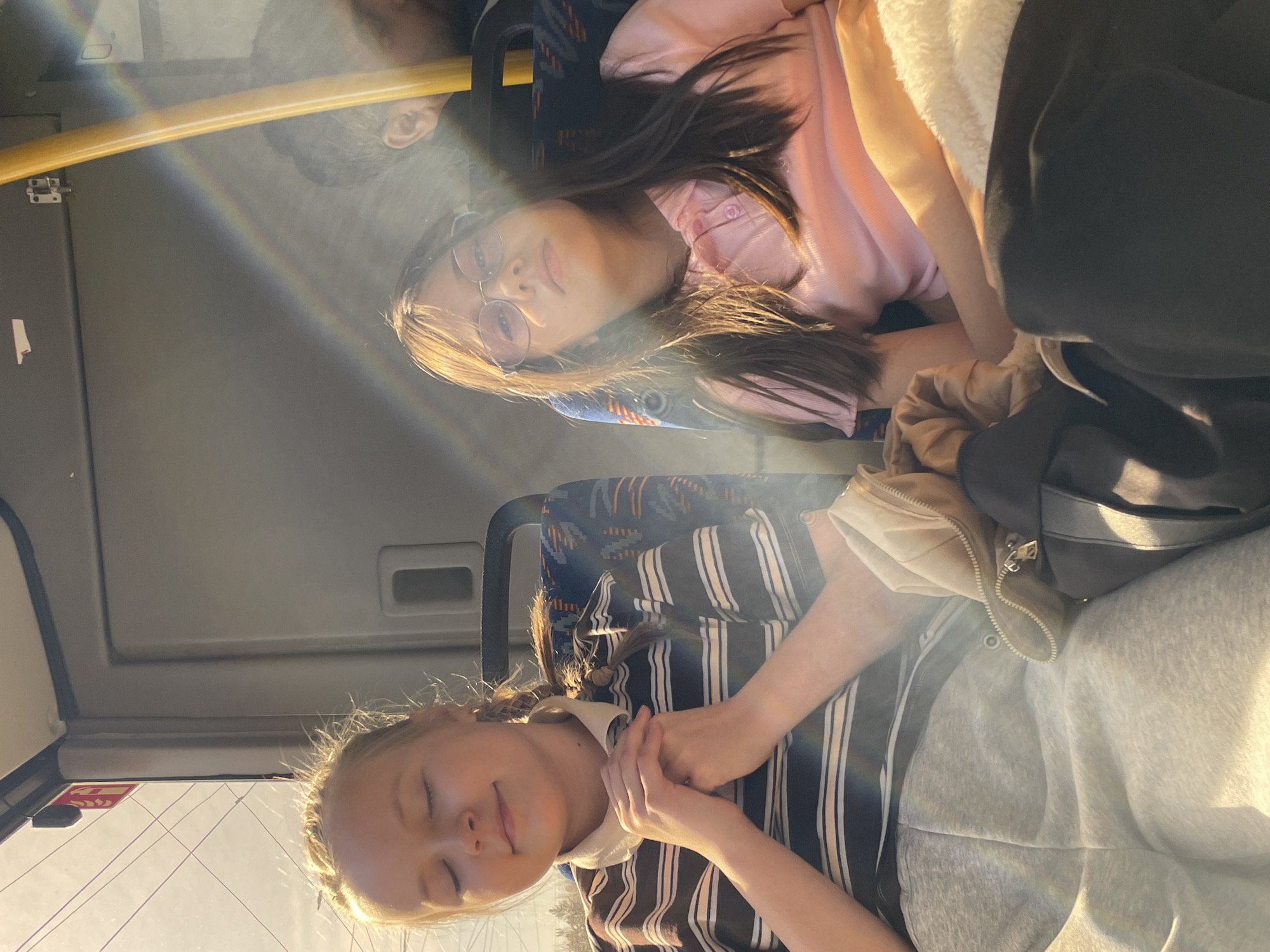 Two women ride bus in Izhevsk during morning commute