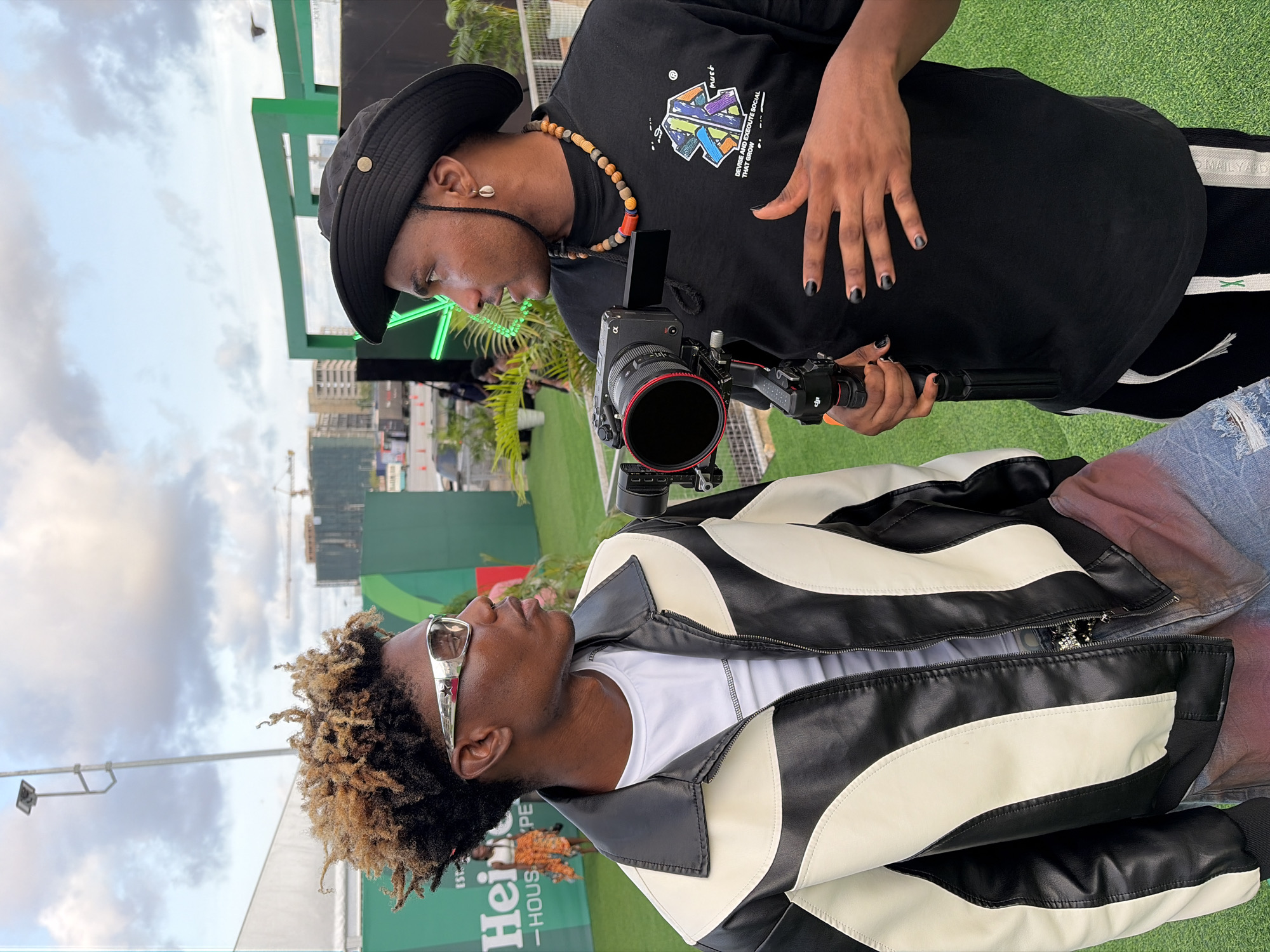Lagos street scenes capture food vendors, film crew, promotional event