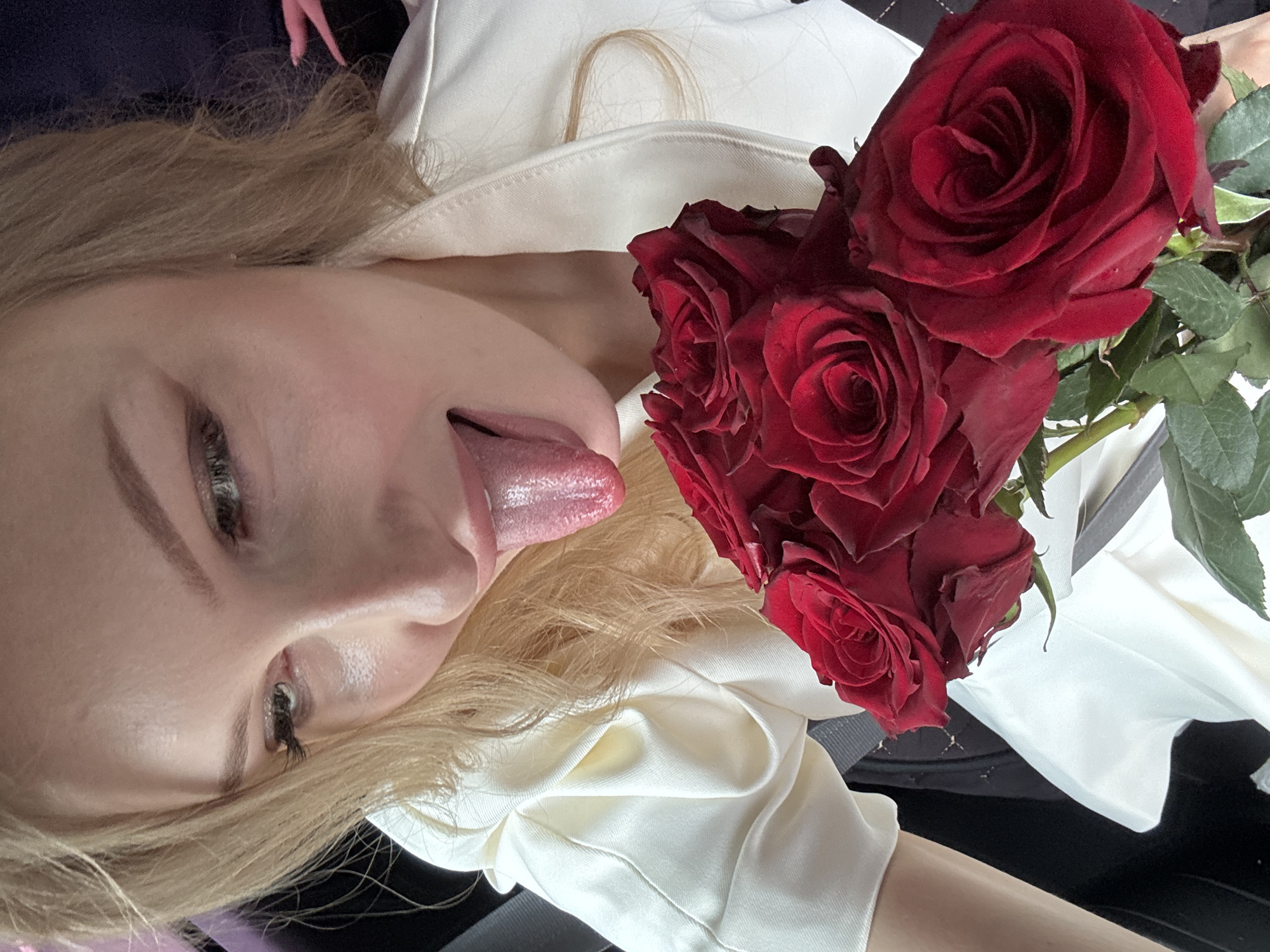 Red roses and selfies in a parked car, Perm