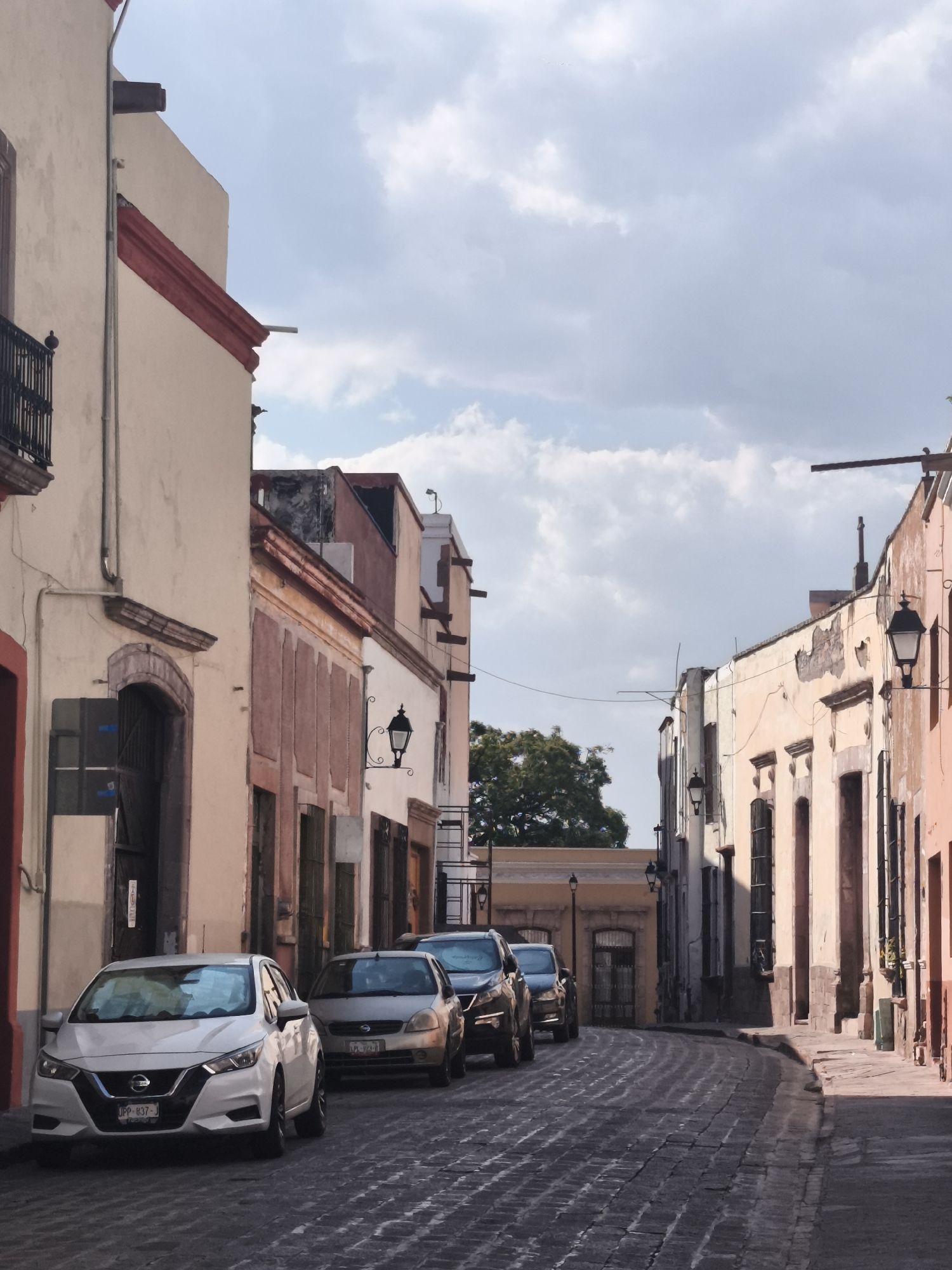 Evening street life documented across historic Querétaro plazas