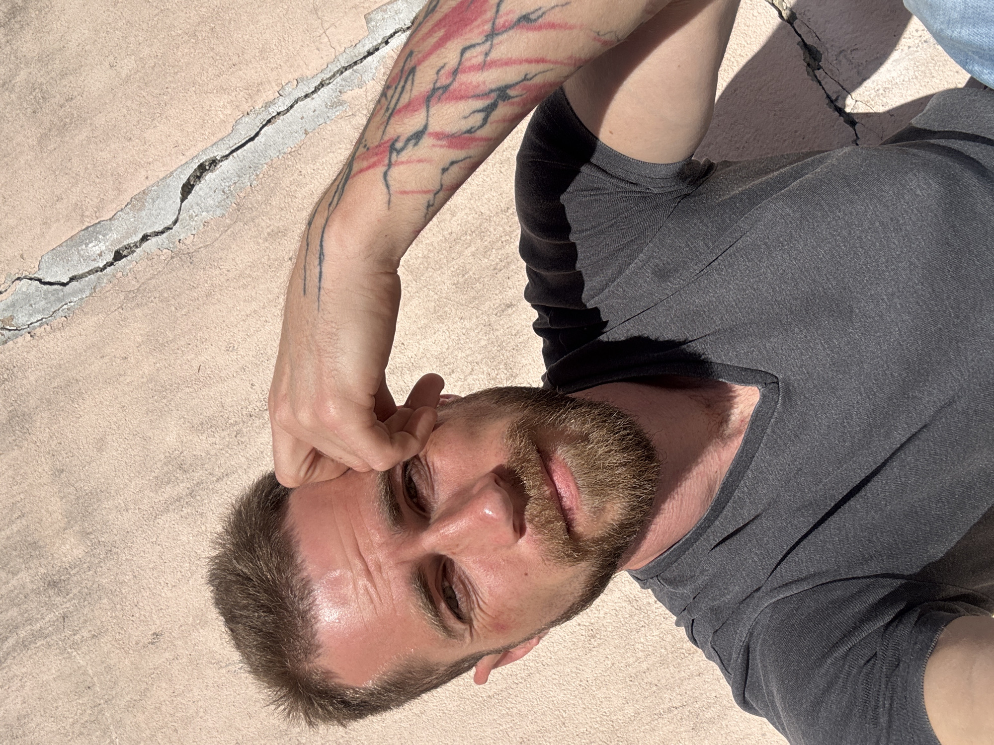 Man on pavement, garage interior documented in Montenegro village