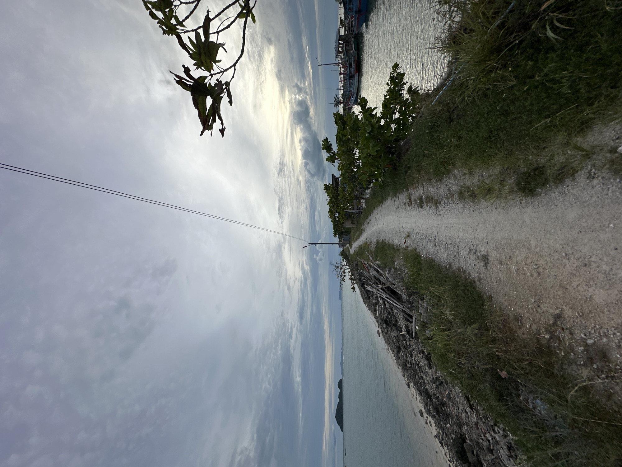Morning stroll along Ko Pha-ngan's rocky harbor shoreline