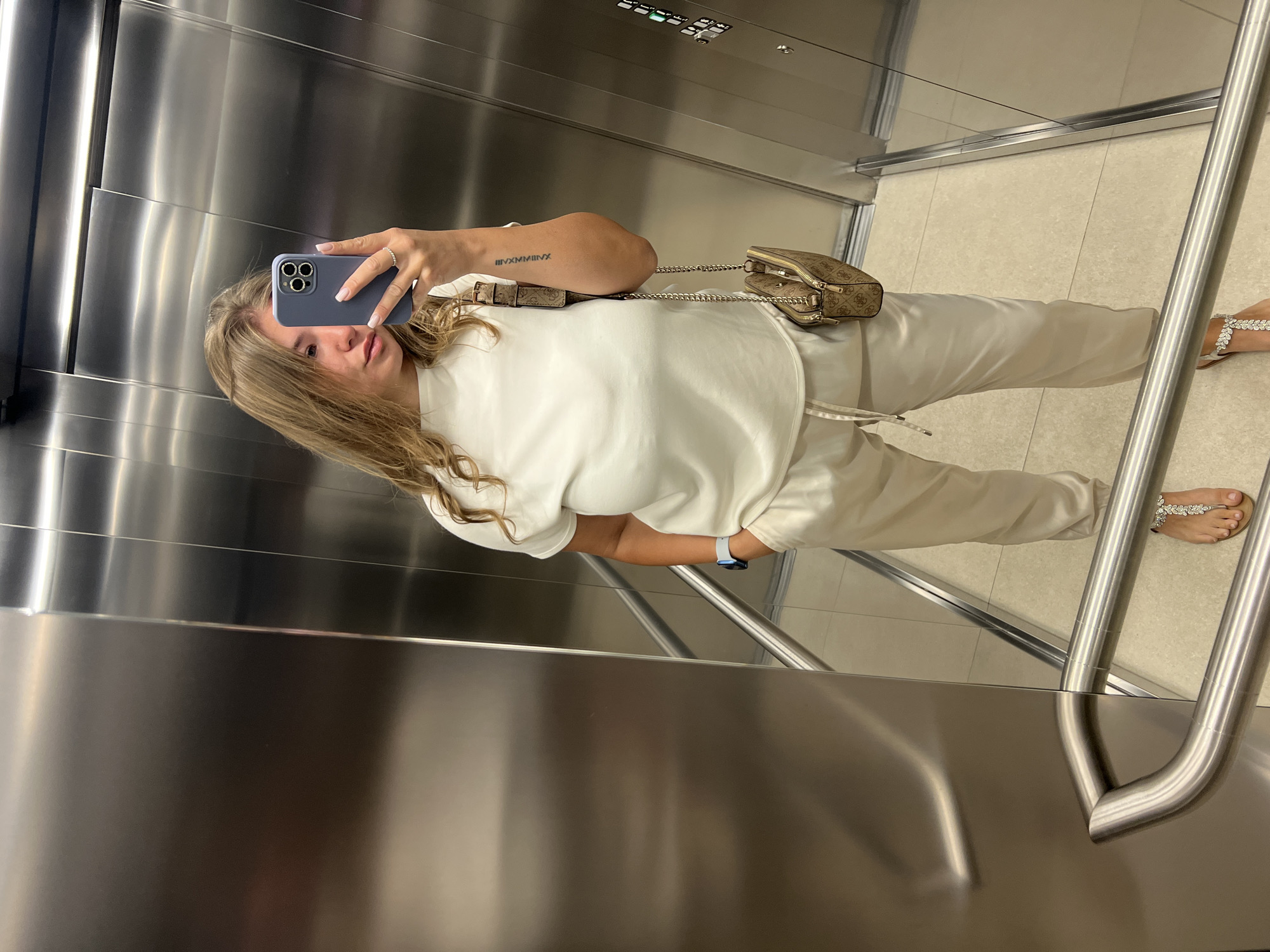 Woman takes elevator selfies in Budva Montenegro morning