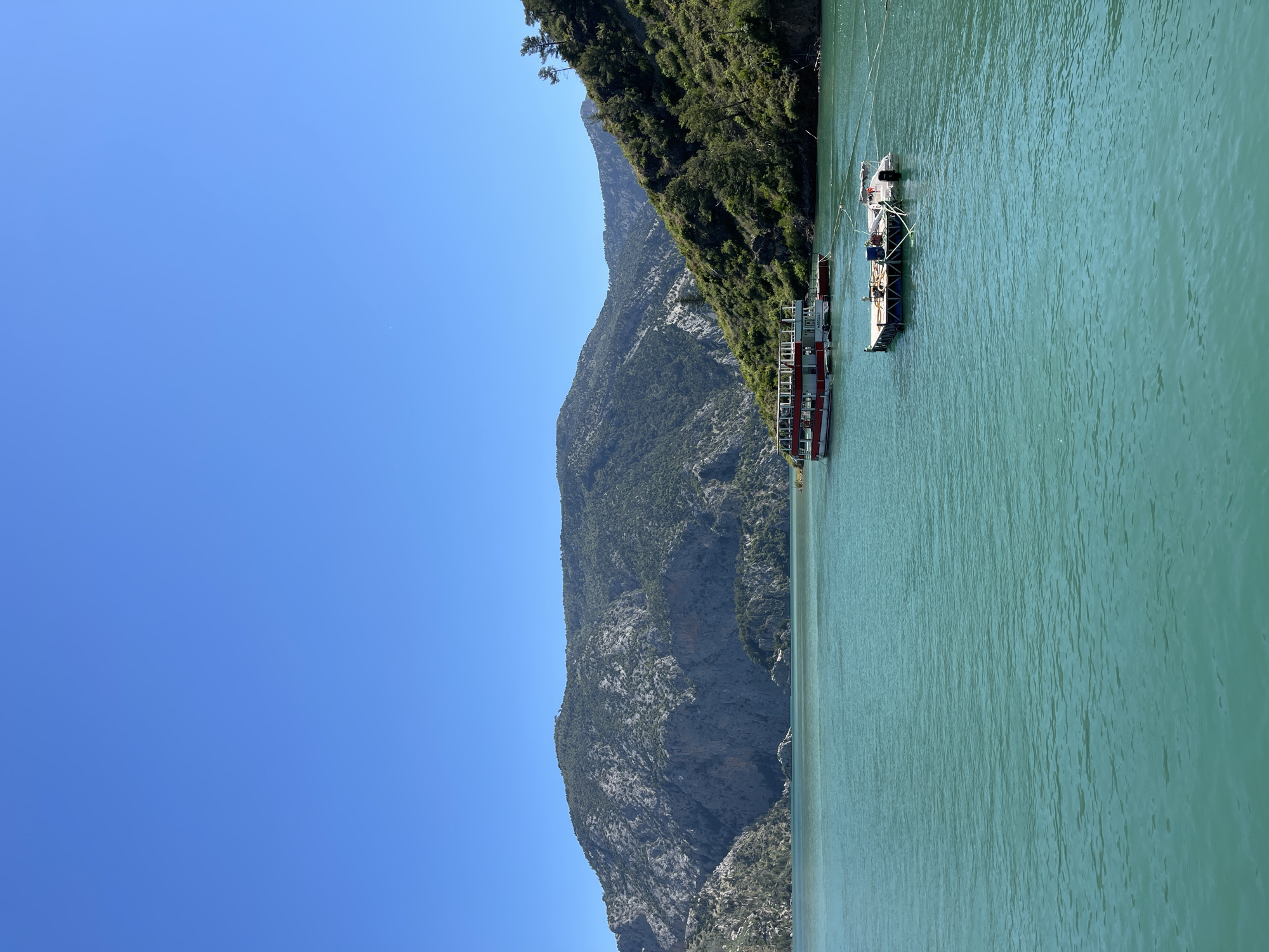 Mountain lake scene with docked boats photographed morning hours