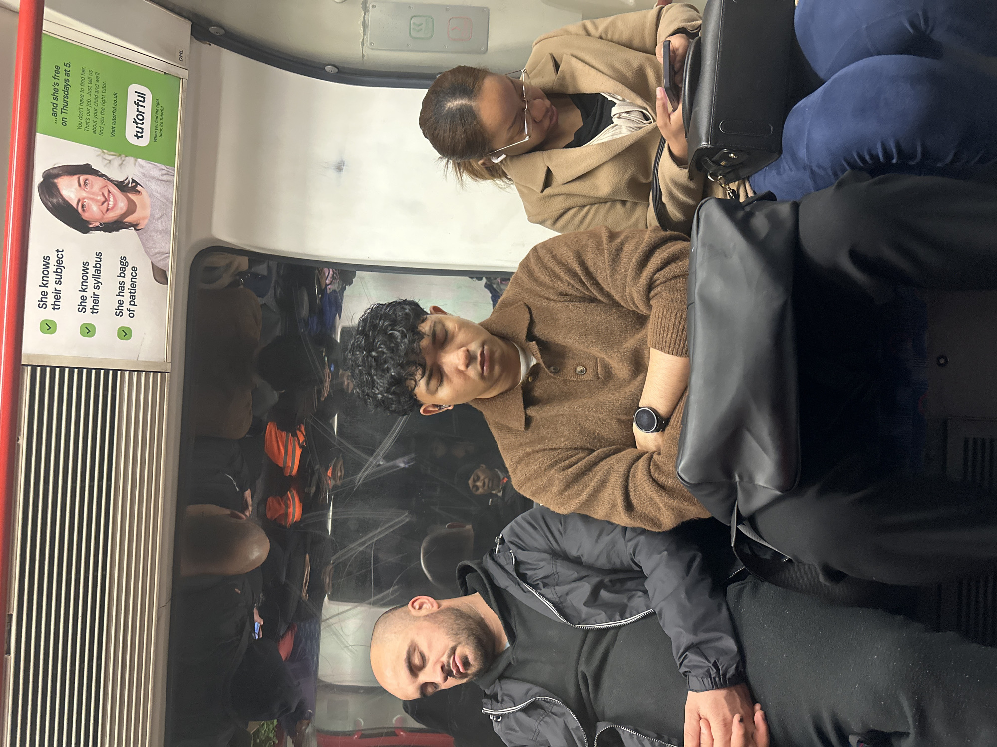 Morning commuters photographed aboard London Underground train