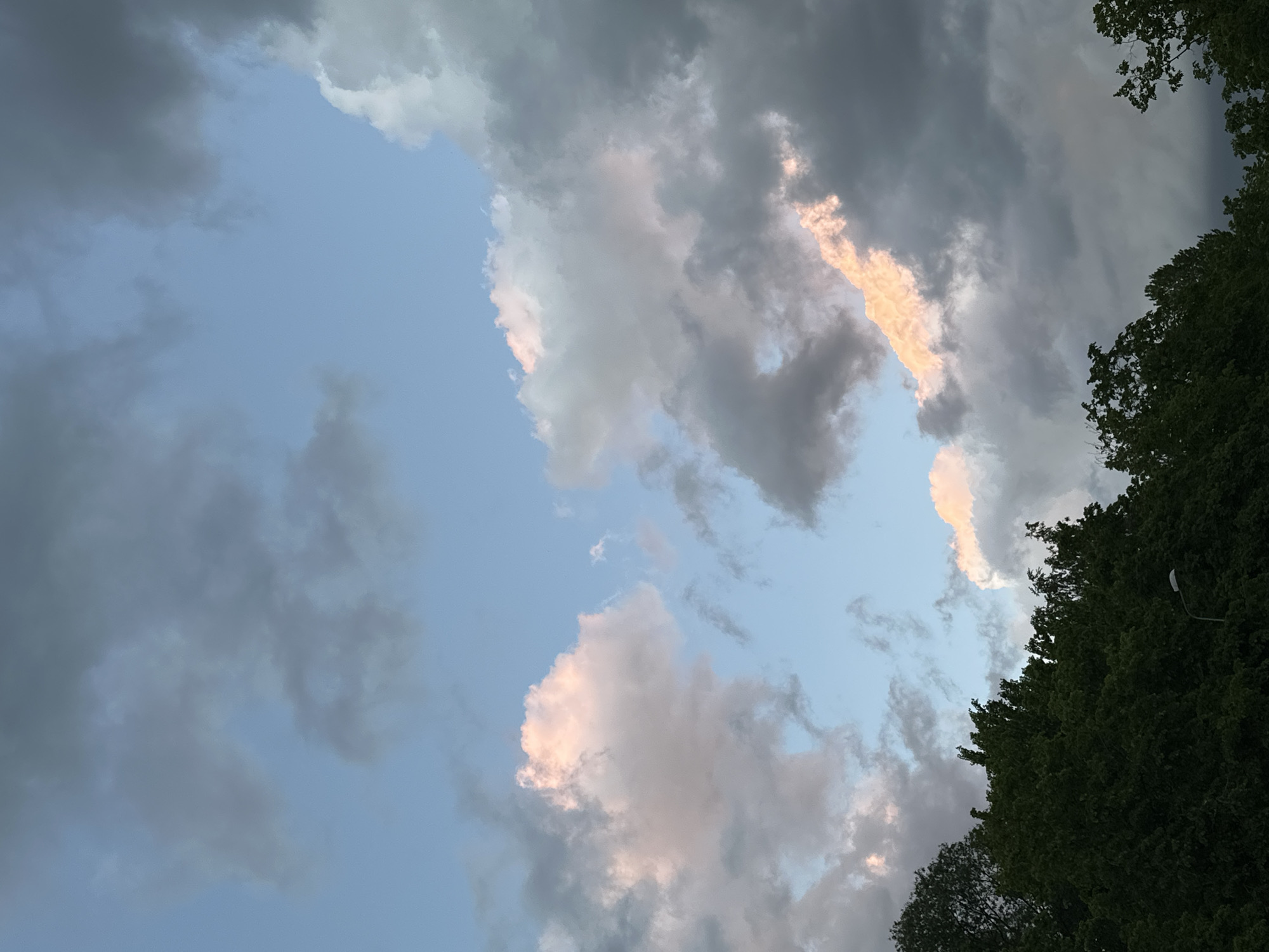 Evening sky with pink-tinted clouds observed in Riga