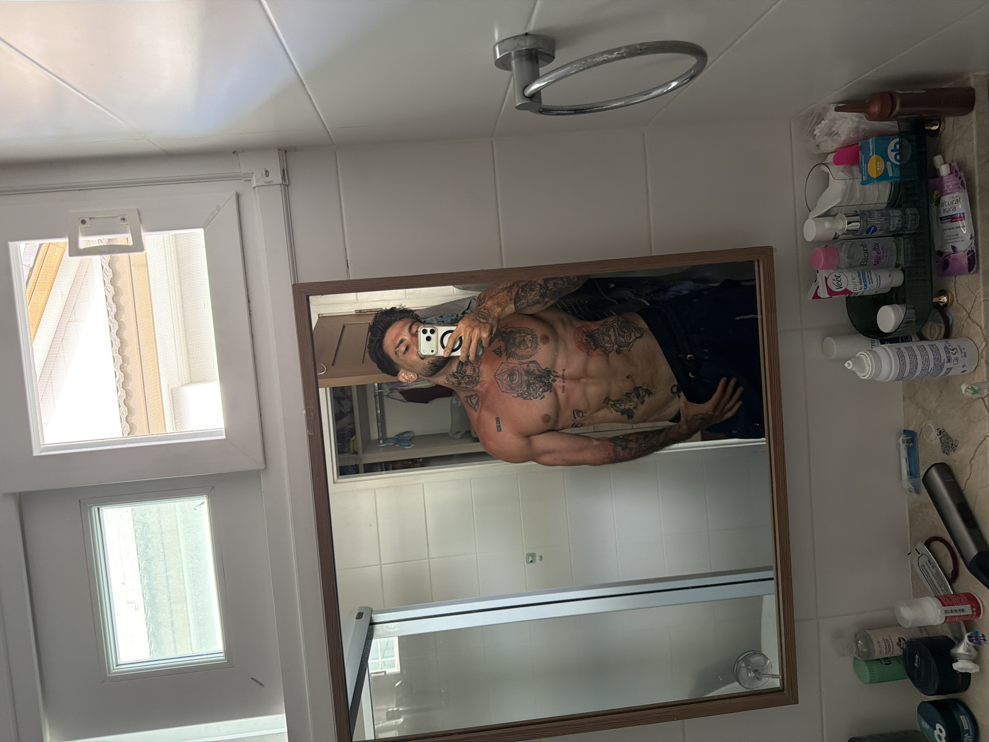 Man takes bathroom mirror selfies in Chalong, Thailand