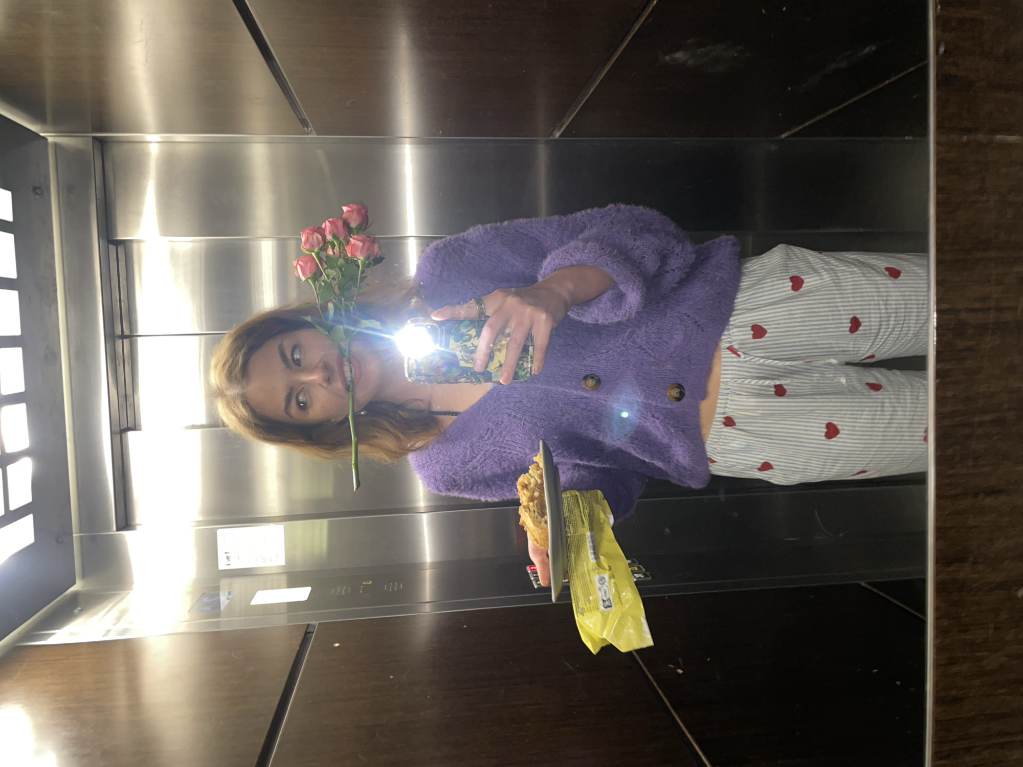 Woman captures casual moments in Boreti elevator selfies
