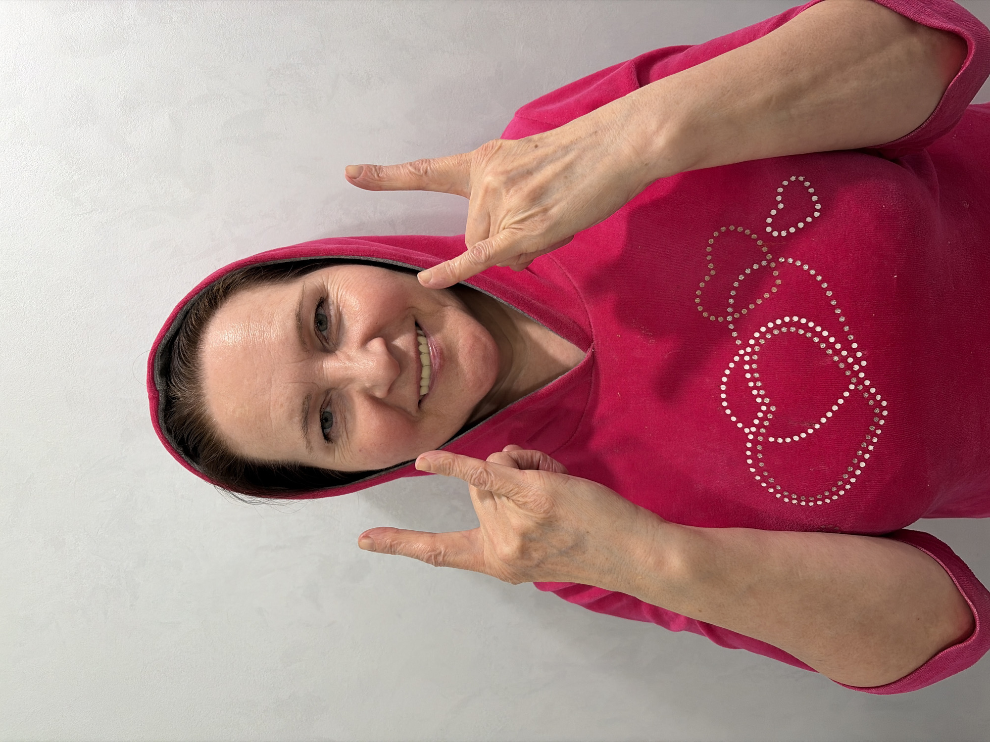 Woman in decorative fuchsia hoodie observed in Neftekamsk