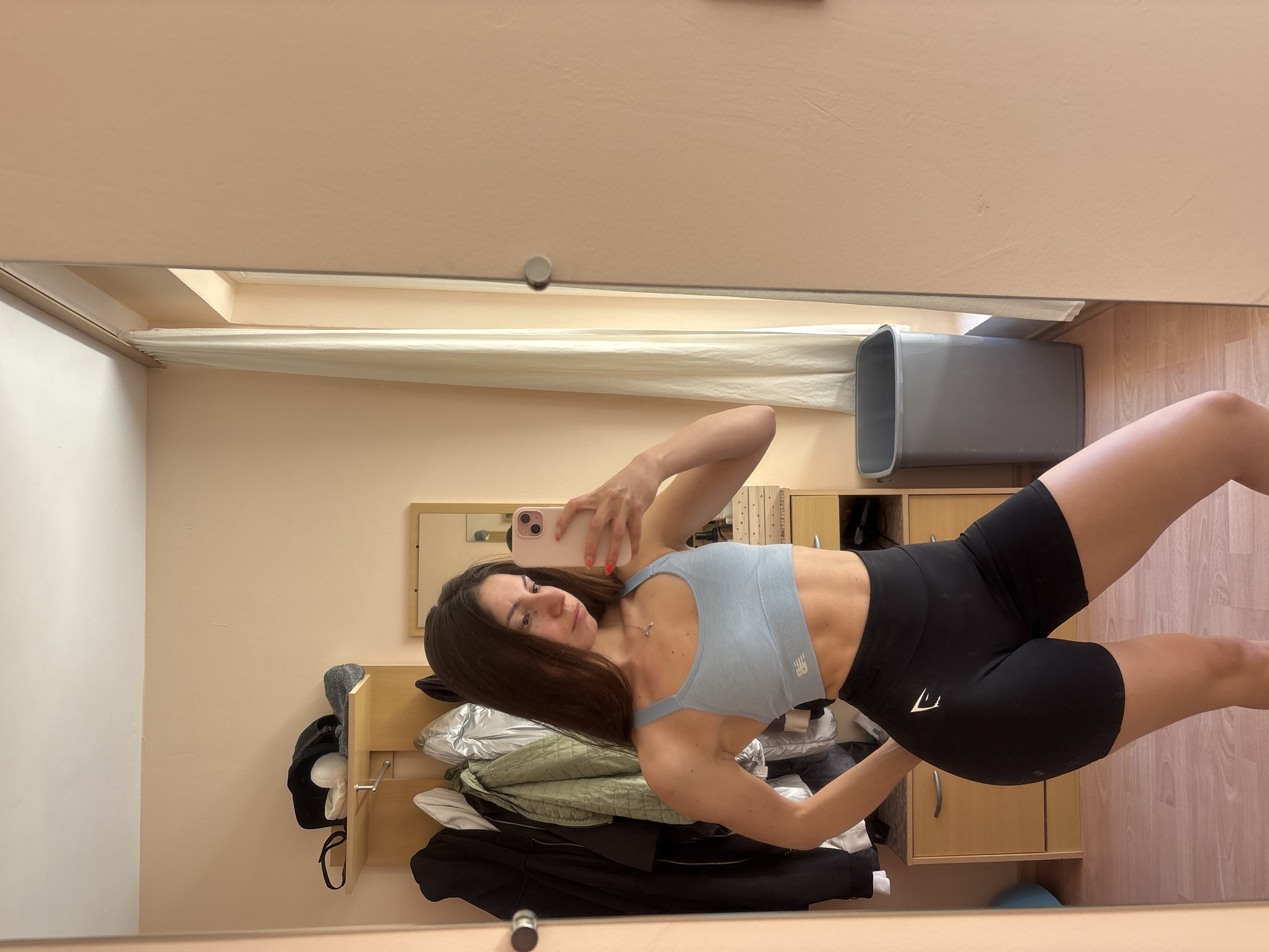 Woman takes workout selfies in Varna bedroom mirror